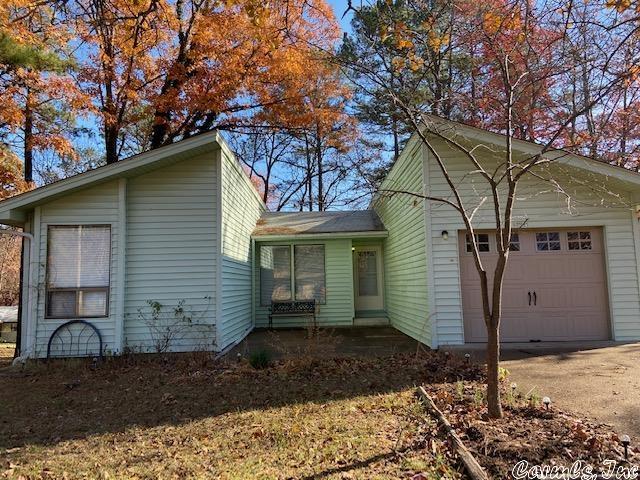 This 2 bedroom, 2 bath home (master en suite) has cathedral ceilings, laundry room, covered (and contained) deck, dining area, breakfast bar and completely fenced back yard for your dog (or toddler). Would make the perfect starter home, lake house or retirement property. New water heater, new toilets in bathrooms. Make it your own with your added TLC. This house is just minutes from the marina, the golf course and other amenities. Fairfield Bay has 3 swimming pools, 2 golf courses, bowling, mini golf, hiking trails, biking trails, RV-UTV trails and more. AGENTS SEE REMARKS.