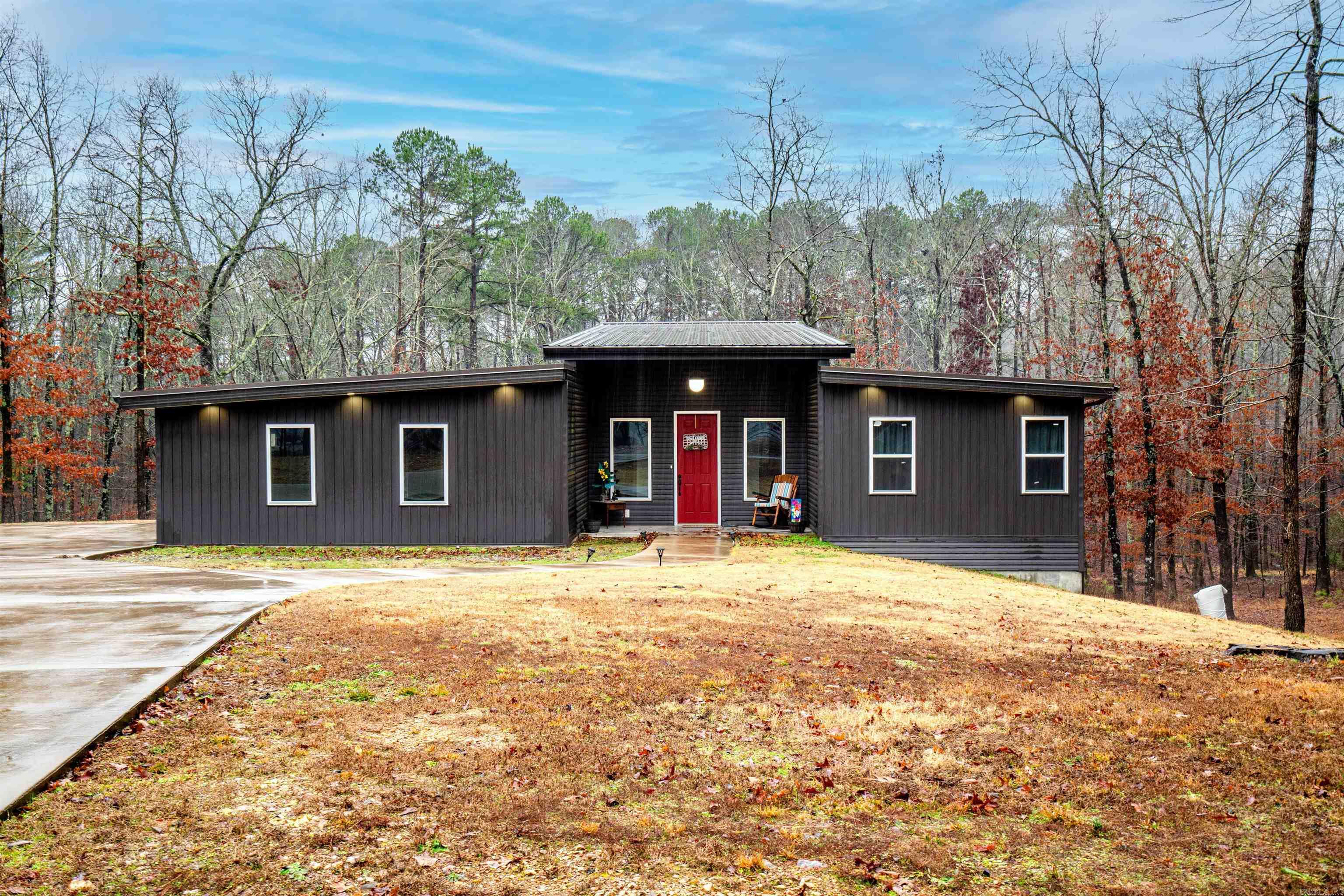 Check out this custom custom built home sitting on 2.20 acres with lots of wildlife to watch out the oversized windows throughout the home. The kitchen features a gas stove and lots of cabinets for storage. The open floor plan is fabulous for entertaining as well. The primary bedroom has a large bath with a walk-in shower and double sinks. All rooms have plenty of natural light from the windows. The outside storage area is great and has barrier already installed. Whole house generator as well.