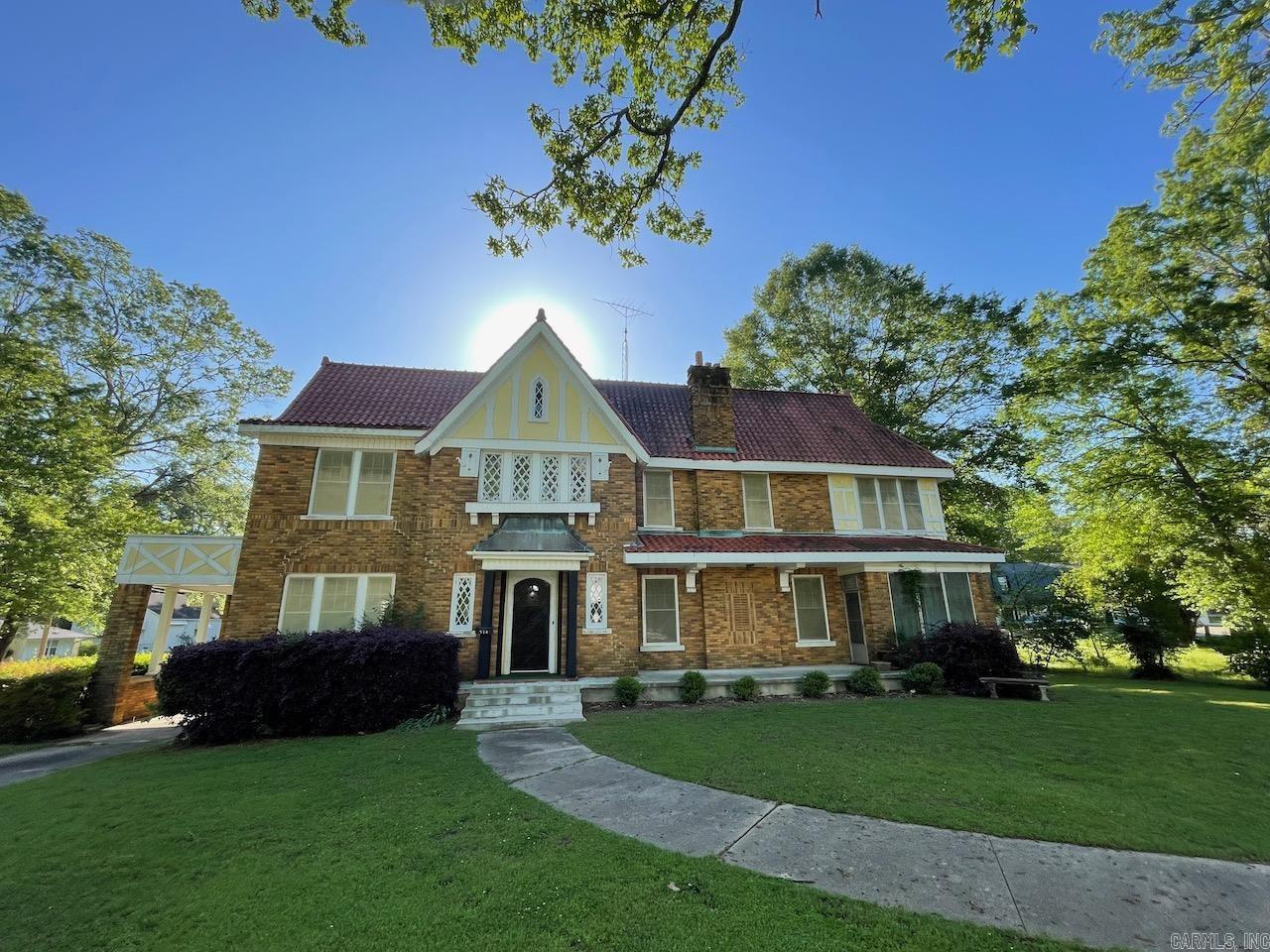 Welcome to your historic dream home nestled in the heart of charming, Monticello where elegance meets modern comfort in this meticulously upgraded Tudor-style residence. Spanning nearly 3600 square feet, this architectural gem sits proudly on a coveted corner lot, offering both privacy and prominence. With its steeply pitched and new gable roof, decorative half-timbering, and rich brick facade, this home exudes timeless historic appeal. Step into a spacious living room where high ceilings and windows invite natural light to dance across the room, highlighting the intricate woodwork and updated finishes. Modern comfort in this beautifully maintained home featuring significant upgrades for peace of mind. A new HVAC system for optimal climate control while the recently installed roof with new gutters and down spouts provides durability and aesthetic appeal. The electrical system has been upgraded, enhancing safety and capacity. Step into a completely remodeled kitchen with modern appliances, sleek cabinetry and stylish finishes. Completely remodeled bathrooms all the way down to the sub floors. Newly installed flower garden in back yard. Some home furnishings convey.