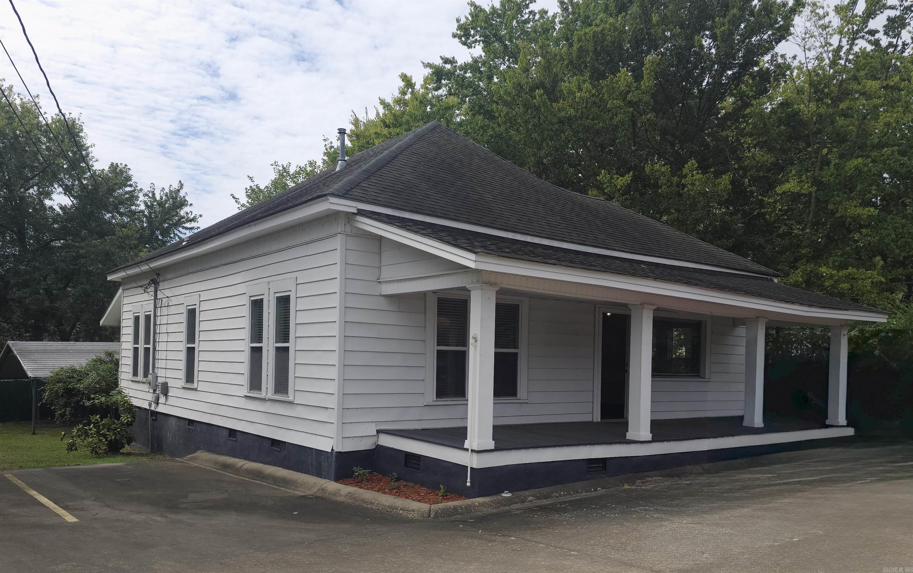 If you are looking for a move-in-ready office space in Clarksville, this is it! The building has been professionally updated and well-maintained, serving perfectly as a financial investment office for many years! The updates were completed to complement the character of this building, originally constructed in 1978 - 10-foot ceilings throughout, windows to allow natural light into each room, and some original interior doors remain. Once you enter off the welcoming front porch, there is ample space for a reception area, two large offices, a conference space, and a full kitchen and bathroom. Don't miss out on the opportunity to make this space your own!