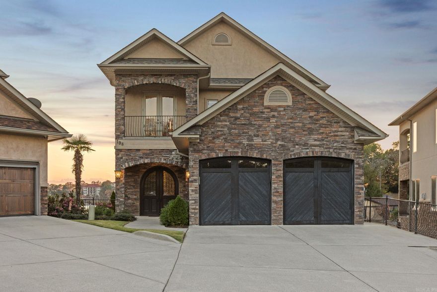 Nestled along 105 ft of Lake Hamilton shoreline, this stunning 4-bedroom, 3.5-bathroom townhouse offers unparalleled lakefront luxury and expansive living across three stories and 4,000 square feet. Perfectly designed for entertaining and relaxation, this residence boasts two spacious living areas, two convenient wet bars, and a dedicated boat slip with a lift. The chef's kitchen is a culinary dream, featuring top-of-the-line Wolf gas stove, Bosch dishwasher, and a built-in Sub-Zero refrigerator. The luxurious master suite is a true retreat, with vaulted ceilings, breathtaking lake views, and its own washer and dryer for added convenience. Two additional bedrooms, as well as a second washer and dryer on the bottom floor, ensure ample space and functionality. With a shared swimming pool and hot tub just steps away, you’ll experience resort-style living year-round. Every detail of this property invites you to relax and enjoy lakefront life at its finest. This is a rare opportunity to own a beautiful waterfront townhouse with unmatched amenities and panoramic views of Lake Hamilton!