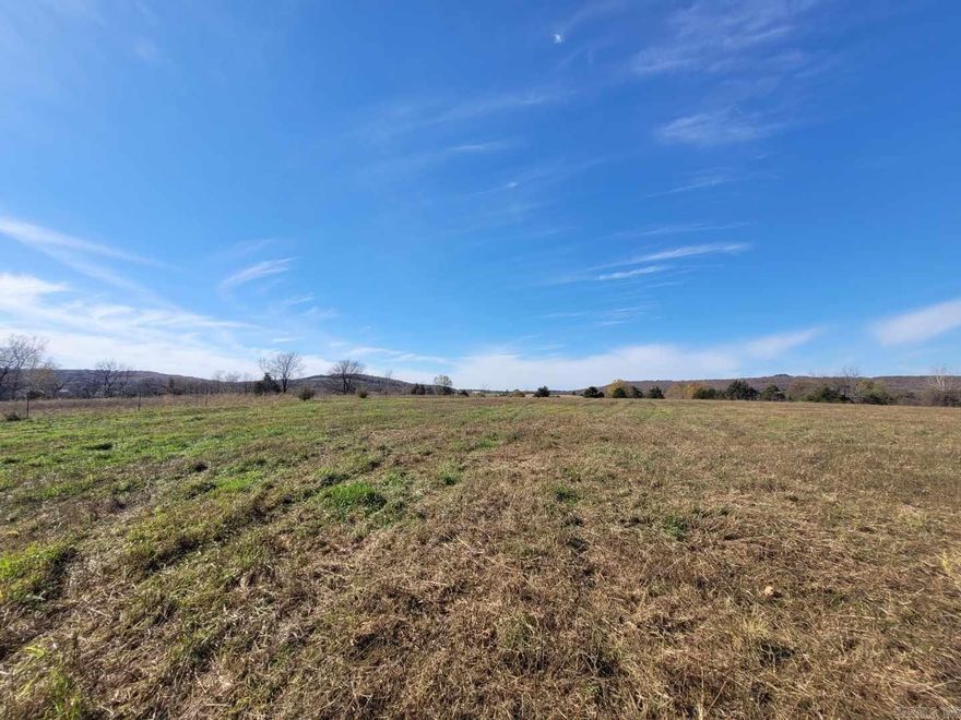 12.8 surveyed acres with a beautiful view of the surrounding hills!  Fenced and cross-fenced.