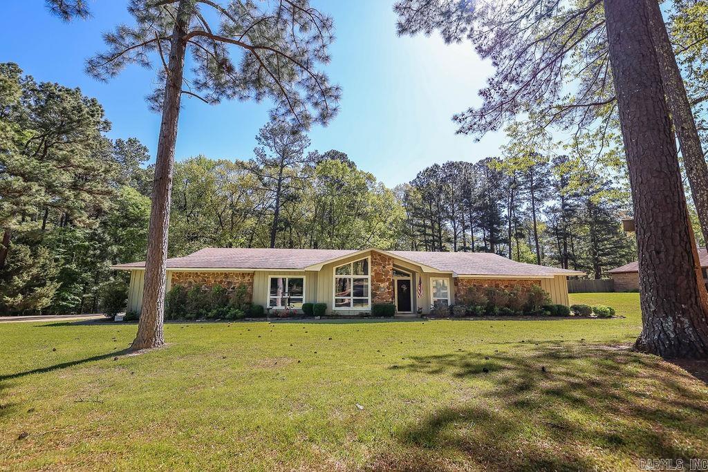 Welcome to your slice of paradise at 1107 Forest Lane, El Dorado, AR 71730! This stunning 4-bedroom, 2.5-bathroom home offers the perfect blend of comfort and convenience. Step inside to discover updates throughout, pay special attention to the beautifully renovated master bathroom complete with a luxurious walk-in, dual-headed shower. The vaulted ceiling dining room and den add an elegant touch to the home, creating a spacious and inviting atmosphere for entertaining guests. Enjoy the serene ambiance of the sunroom, perfect for relaxing with a morning coffee or unwinding after a long day. Situated on 1.03 acres on a quiet street, you'll feel like you're miles away from the hustle and bustle, yet just minutes from town. Surrounded by wooded areas, this home offers a sense of tranquility and privacy while still being close to all the amenities El Dorado has to offer. Don't miss out on the opportunity to make this your forever home. Schedule a viewing today and experience the peaceful elegance of 1107 Forest Lane!