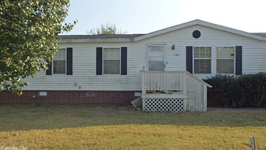 Corporate owned property sold as-is, where-is in East Conway.  Mobile is on a permanent foundation per neighbors, comes with 4 BR/2BA, two living areas and a fireplace.  Exterior is fenced with storage bldg and 2 car carport.  A great buy for the price! - ATTN AGENTS ALL OFFERS TO BE SUBMITTED THROUGH PROPOFFERS.COM. Buyers Agent comm is 1062.50