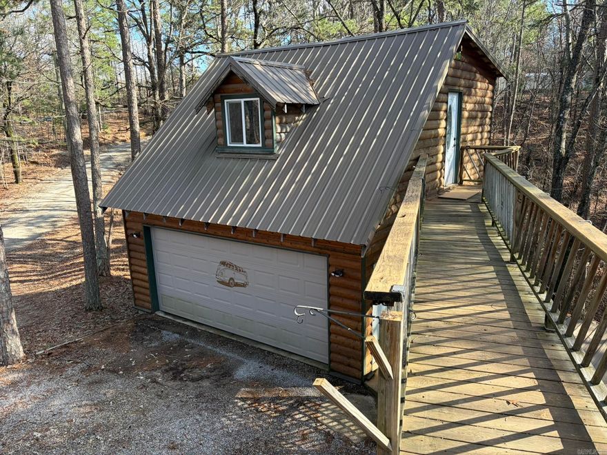 Your own little piece of paradise in the mountains, @2 miles from the round about outside the Village Gates.  Approx 5.48 wooded acres, this property offers a 1 bedroom, one bath efficiency apartment located above the 20x24 double garage.  Property offers existing well and public water.  House pad, clean and ready to build your dream home.  Contact listing agent for more information or to schedule a viewing.