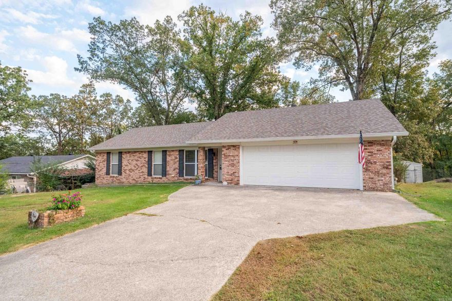 Charming 3-Bedroom, 3-Bath Brick Home in Lake Hamilton School District! Welcome to this spacious and well-maintained brick home nestled in the desirable Lake Hamilton School District. Boasting 3 bedrooms and 3 full bathrooms, this home offers a unique layout featuring two master suites, perfect for multi-generational living or guest accommodations. One of the master suites includes a  jetted tub and separate shower for ultimate relaxation. Enjoy plenty of room to spread out with two living areas and a large den complete with a cozy fireplace insert and blowers, ideal for cool evenings and family gatherings. The kitchen and dining flow seamlessly into the living spaces, making entertaining a breeze. Step outside to a covered back patio overlooking the spacious backyard—perfect for kids, pets, and outdoor fun. Two storage buildings provide ample room for tools, hobbies, or seasonal items. Additional features include a 2-car garage, new HVAC system, and great curb appeal with a classic brick exterior. This home truly offers the comfort, space, and convenience today's buyers are looking for. Don’t miss the opportunity to make this versatile and inviting property your new home!