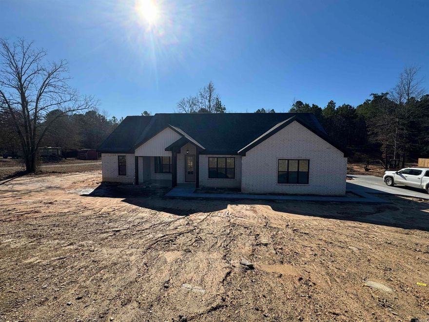 Nestled in the tranquil Meadow Acres subdivision, this charming 3 bedroom, 2 bath home awaits your arrival, offering a seamless blend of comfort and style. As you step through the front door, you are immediately greeted by the expansive feel of vaulted ceilings that create an atmosphere of airy spaciousness.   The heart of the home features a cozy fireplace, perfect for gathering with loved ones on chilly evenings. Each bedroom is meticulously designed to provide a serene retreat, with ample space for rest and rejuvenation. The master suite boasts its own private bath, ensuring a private oasis for the homeowners.  Sprawling from the main living area is a large back porch, providing an idyllic setting for morning coffee or hosting summer barbecues, while overlooking your peaceful, landscaped backyard.  This gem in Meadow Acres offers not just a house but a place to truly call home. Whether you’re entertaining guests or enjoying quiet moments, this property captures the essence of a comfortable and inviting abode.