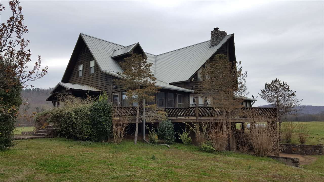 This spacious retreat is an angler's or nature lover's dream! Situated on the bank of the White River facing Painter's Bluff with 129 plus acres, priced well below appraisal. Annual income from hay field and VRBO.  Grass air landing strip, carport/garage apartment and 2 large out buildings are included. Great for multi-family use, rental or a business retreat! Newer high-end furnishings are negotiable. Sellers willing to subdivide.