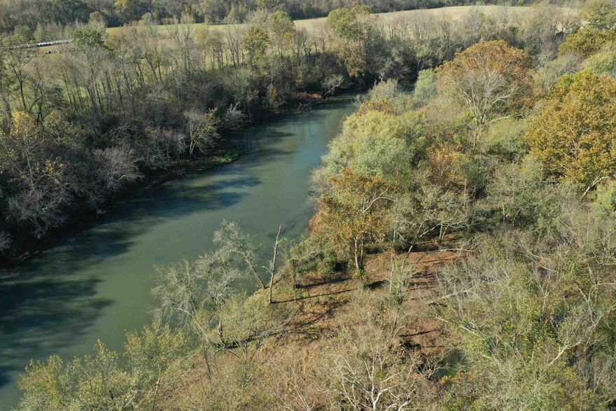 Approximately 2 acres of Little Red River frontage for sale on a wadable section of the river that is immediately downstream from the Mossy Shoals Catch & Release area. The property is Lots 8 & 9 of the Mossy Shoals Resort subdivision. The property has a great cleared building site high above the river with a road and bridge that leads straight to the water's edge. The island (accessed by the bridge) has rock work that has been completed. This property is quiet oasis located at the end of Cedar Glade in Pangburn. Properties with wadable water access do not become available very often, don't miss out on this one! The seller will not subdivide.