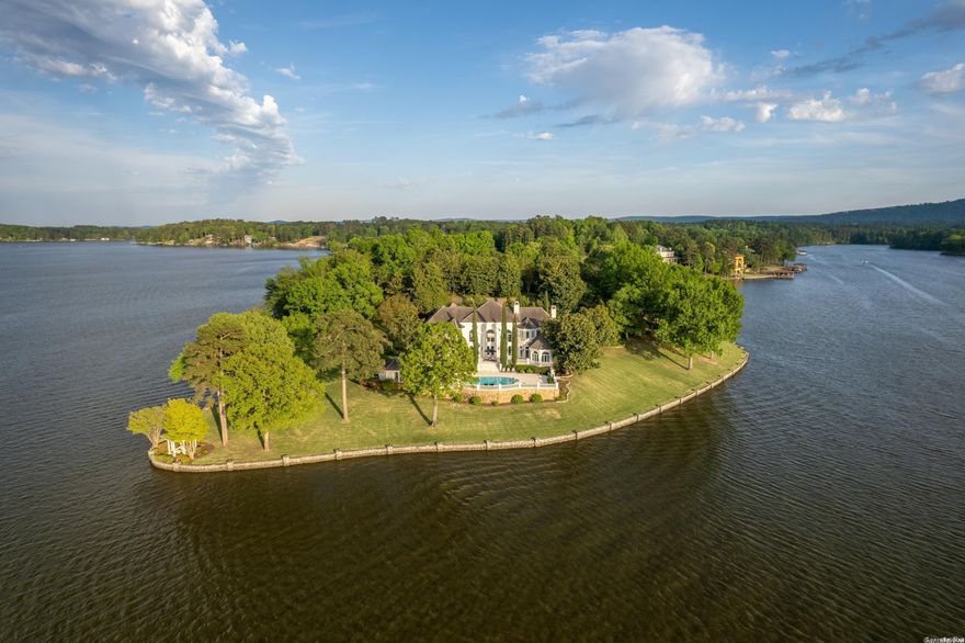 This magnificent lakefront estate is truly as good as it gets in Hot Springs. Situated on 5 premier point lots in prestigious Driftwood Subdivision, this 7815 sq.ft. masterpiece is unrivaled in terms of its features, design and location on Lake Hamilton. The level of construction & attention to detail throughout the home & grounds is spectacular. Over 1000' ft. of lake frontage, gated entry, mature landscaping. Very private & secure. The 2 vacant lake lots could also be built on (ideal for a family estate).