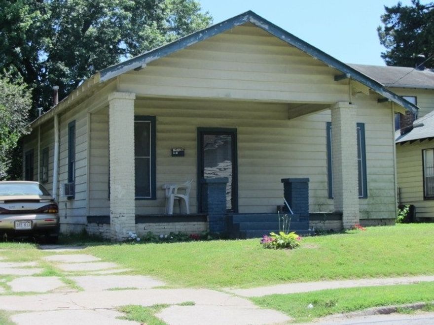 Great investment property has house and two extra lots measuring 7,000 s.f. each.  Sq.ft. of house is estimated.  Measuring is encouraged.