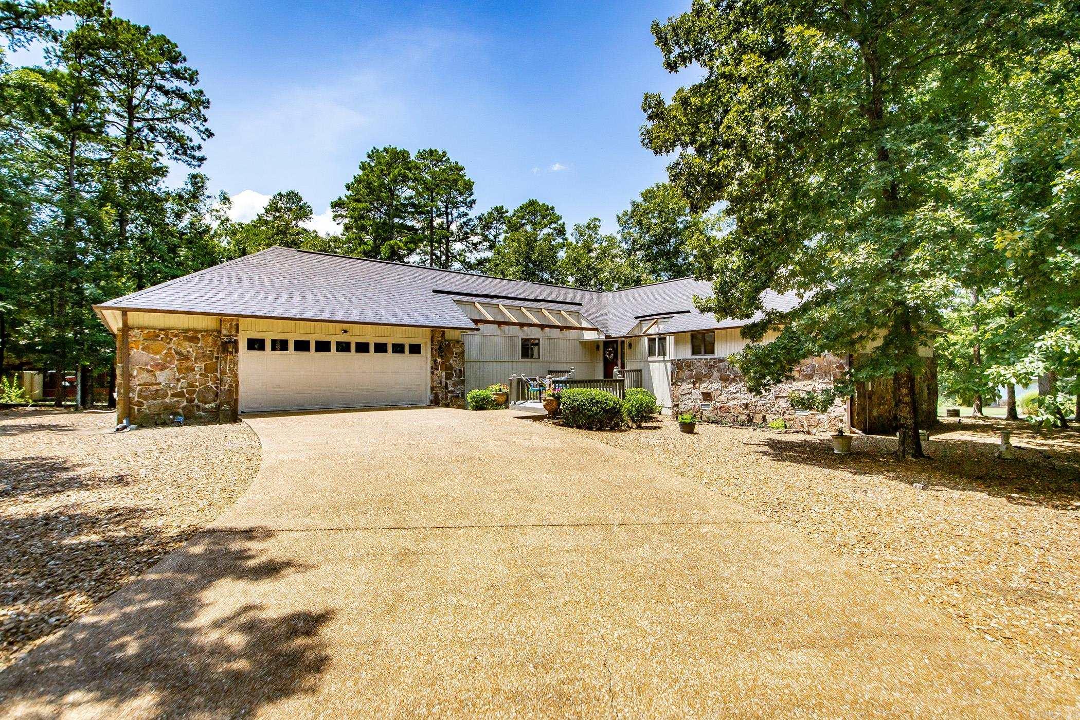**Attention Golf Lovers!** You wonāt want to miss this golf course home! Itās located near hole number 15 of the Indian Hills Golf Course on a quiet cul-de-sac just off the main road. This well-kept home has 3 bedrooms and 2.5 bathrooms. You will love the sunroom, and there are 3 amazing decks for entertaining! Storage is not a problem here. The oversized 2.5-car garage can fit two vehicles and an ATV, perfect for those ATV trails in Fairfield Bay! You'll also find an almost fully-floored attic for extra storage and a golf cart garage. The inside of the home offers plenty of storage, too. Many updates have been made, including granite countertops in the kitchen, quartz countertops in the bathrooms, Anderson windows with built-in blinds, new gutters, GFCI electrical outlets that meet code, new garage door controls, and updated plumbing. Come see how well-loved this home is!