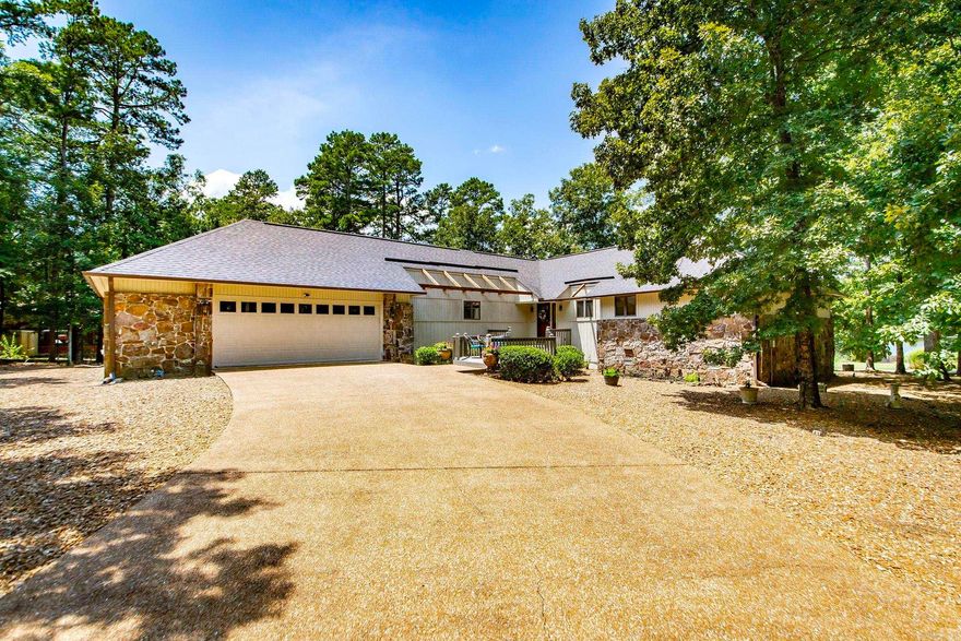 **Attention Golf Lovers!** You won’t want to miss this golf course home! It’s located near hole number 15 of the Indian Hills Golf Course on a quiet cul-de-sac just off the main road. This well-kept home has 3 bedrooms and 2.5 bathrooms. You will love the sunroom, and there are 3 amazing decks for entertaining!   Storage is not a problem here. The oversized 2.5-car garage can fit two vehicles and an ATV, perfect for those ATV trails in Fairfield Bay! You'll also find an almost fully-floored attic for extra storage and a golf cart garage. The inside of the home offers plenty of storage, too.   Many updates have been made, including granite countertops in the kitchen, quartz countertops in the bathrooms, Anderson windows with built-in blinds, new gutters, GFCI electrical outlets that meet code, new garage door controls, and updated plumbing.  Come see how well-loved this home is!