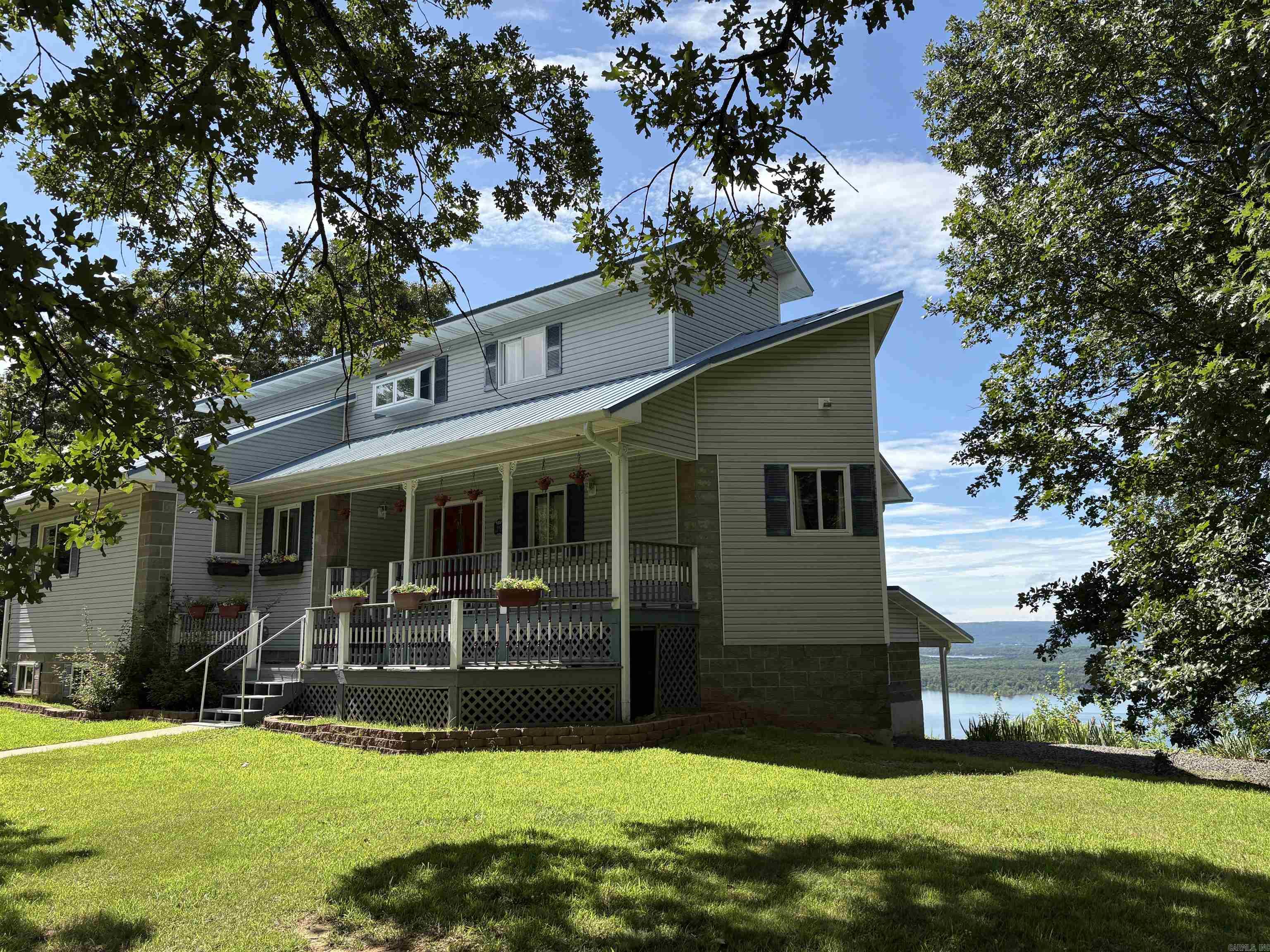 Gorgeous Lake View from every room and multiple decks! 2 Story plus walkout basement apartment with own exterior access. Elevator lift to top floor master... and best view in the home! Large detached garage/carport/shop/storage plus Exercise POOL room! Amazing AirBnB opportunity.