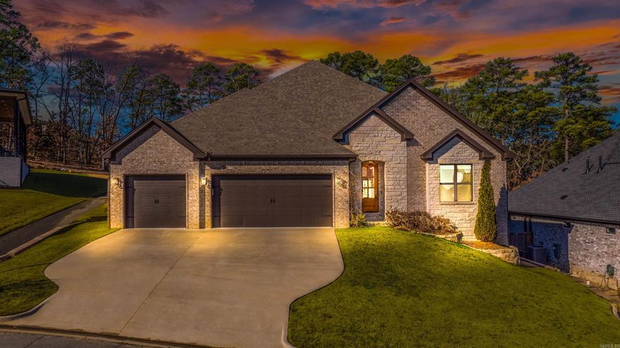 Experience the ultimate lifestyle upgrade in this vibrant, custom-built home nestled in the prestigious Chenal Valley. Whether you're a nature lover, an active professional, or looking for a long-term sanctuary, this single-story retreat offers a rare blend of luxury and convenience, backing directly onto protected green space, scenic walking trails, and breathtaking views of Pinnacle Mountain.  Inside, the light-filled open floor plan is designed for modern living, providing a perfect flow for social gatherings or a quiet night in. Custom upgrades include hardwood floors, touchless faucets, dimmed light fixtures, custom premium  window shades, ADT security and much more. With four spacious bedrooms—each featuring its own walk-in closet—2.5 stylish baths, and a massive 3-car garage, this home offers the flexibility needed for a home office, hobby room, or guest accommodations. Move in ready, this home is complete with a high end refrigerator, washer and dryer. Located just minutes from the Promenade at Chenal, you’ll have easy access to top-tier dining, golfing and shopping while living in one of the most scenic landscapes in the Natural State.