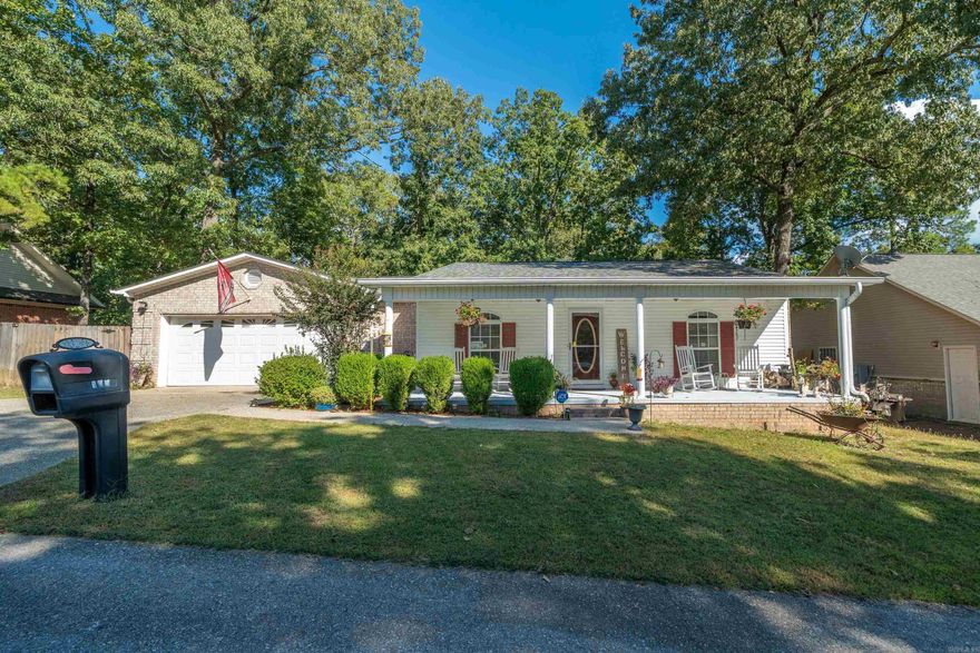 A charming residential property nestled in a serene, natural setting. Located in the heart of the Ouachita Mountains, this home offers a perfect blend of comfort and  beauty. The property is situated in a quiet neighborhood, providing a peaceful retreat from the hustle and bustle of city life while still being conveniently close to the vibrant downtown Hot Springs. The house itself is a spacious, well-maintained structure with a cozy yet open floor plan. It features a welcoming living room with electric fireplace for those cold winter nights. The kitchen is modern and functional, with ample cabinet space and an island for extra workspace & storage. 4 bedrooms in which one is used as an office. Outside, the home boasts a fully fenced back yard offering plenty of privacy and opportunities for outdoor activities and room for those fur babies. Enjoy the above ground pool and a large deck serves as an excellent spot for cookouts, entertaining family and friends. Also enjoy the fresh air, whether you're sipping your morning coffee, watching tv or just relaxing. Located just a few steps to Lake Hamilton and minutes to Lake Ouachita. Lake Hamilton Schools. Book your showing today!