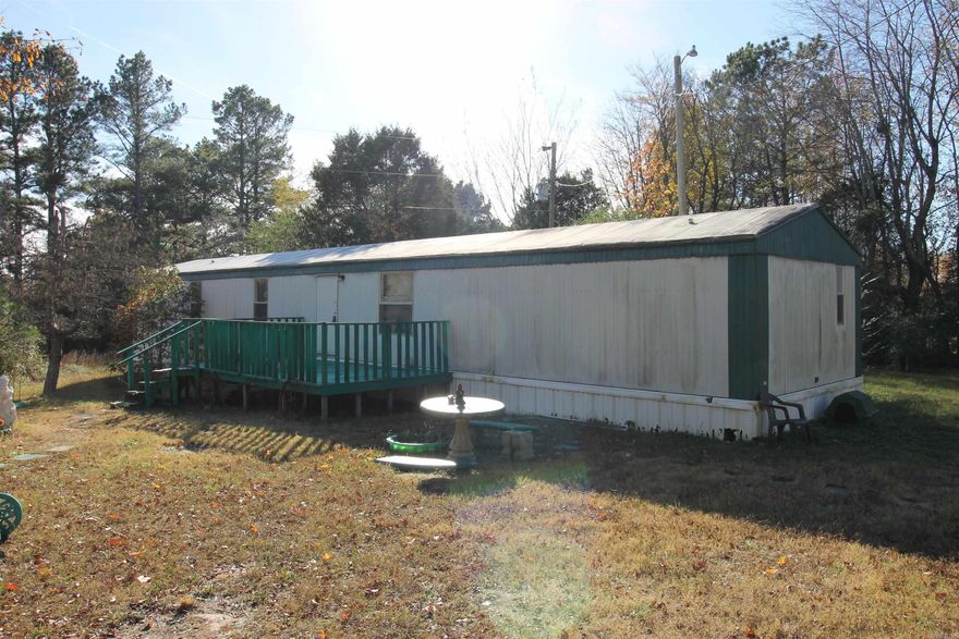Quiet and serene. This manufactured home is located off the beaten path in Oak Grove right off Hwy 34. There is privacy, places to roam, and room to grow. This home features included 3 bedroom and two full baths. The master bedroom is large with a spacious bathroom that includes the garden tub, double basin sink and walk in shower. This property also includes two storage buildings and two detached covered concreate parking pads.