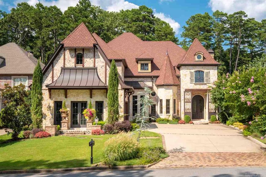 Custom showcase, gated, adjoining Chenal CC. Outdoor entertaining- covered veranda, 2 outdoor FP, salt water heated pool/waterfall spa, outdoor TV & pool bath. Travertine floors, wet bar, hearth room, open floor plan, mud room, 2 laundry rooms. Chef's kitchen- gas 6 burner/griddle Thermador, pot filler, granite, built-in frig. Master- soaker tub, dual sided shower, 2 water closets. Theater- mini kitchen. Central vac, mosquito mist, intercom surround sound, extra landscaping, cameras. POA does all lawn care.