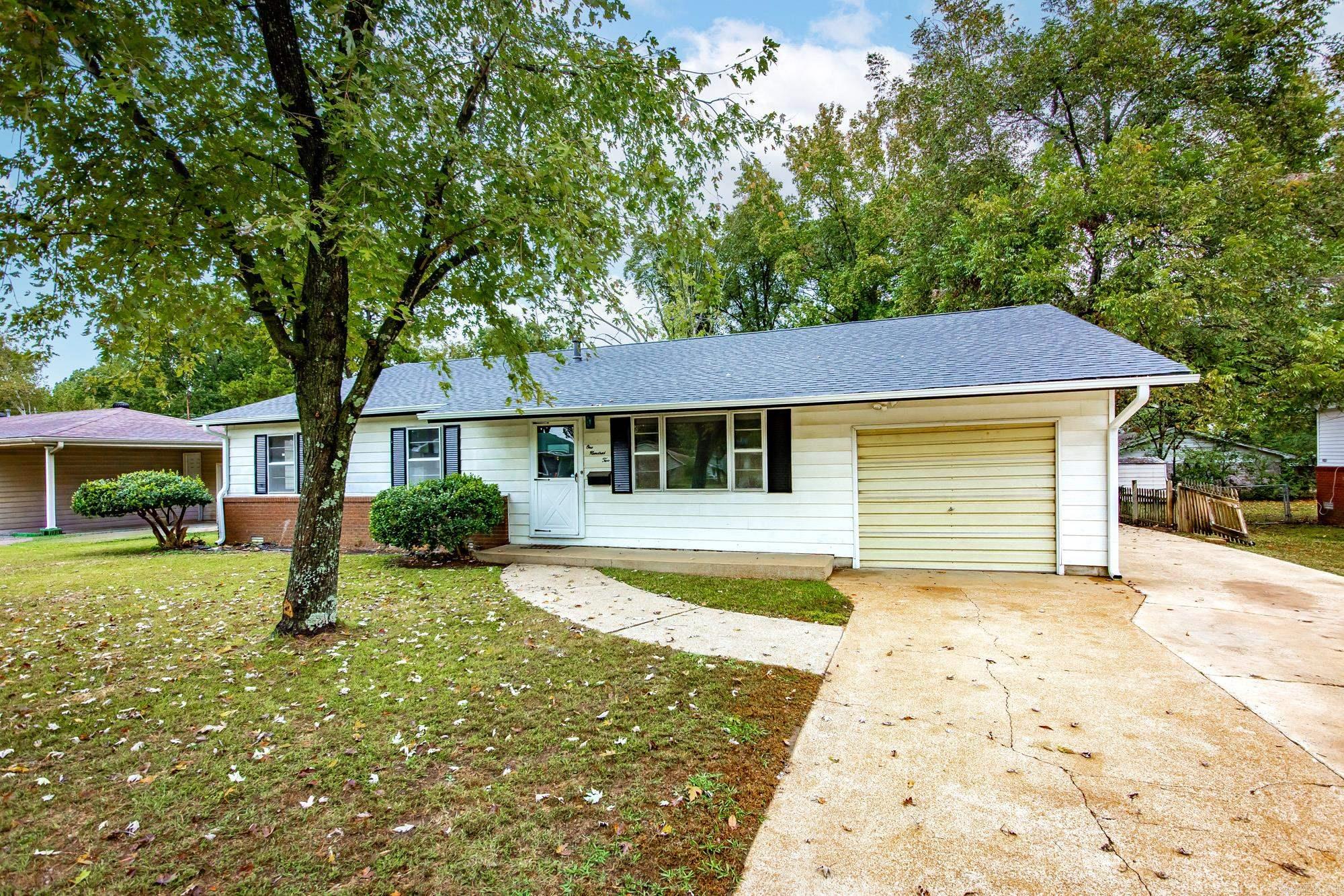 Discover exceptional space, value, and versatility in this welcoming Searcy home featuring a brand-new roof and multiple areas designed to fit your lifestyle. The main level offers a comfortable living room ideal for relaxing, along with a cozy den that provides a second gathering area perfect for movie nights or casual entertaining. A large bonus room offers endless possibilities and can be easily used as a game room, home gym, office, playroom, or additional lounge space to accommodate changing needs. The attached two-car garage is accessible directly from inside the home and includes space above that can serve as additional storage or be finished out in the future, giving you room to expand. Outside, you will love having a separate workshop with its own exterior entry, perfect for hobbies, woodworking, equipment storage, or any hands-on projects. The lot provides plenty of outdoor enjoyment opportunities with room for gardening, pets, or outdoor seating areas. Conveniently located near schools, restaurants, local shopping, and daily necessities, this property delivers both comfort and practicality. Whether you are looking for more room to spread out or spaces that adapt as life