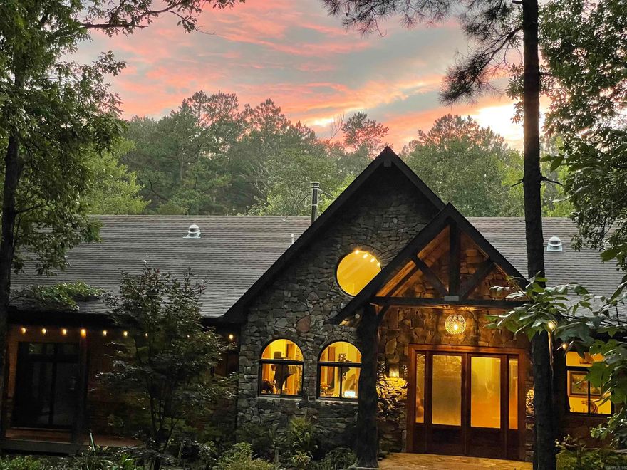 160 ac eco-paradise with luxury home, beautiful mature forest and clear spring fed creek, bordered by National Forest. Perfect for a private nature retreat or mountain bike/equestrian trails. Artistic custom home has cathedral ceilings, open design with many windows and skylights, beautiful native stone and cedar accents, and a 1200 sq ft walk-around deck overlooking the creek and nearby swimming hole. Home has blown-in foam insulation and a geothermal system keeps the house a pleasant temperature, regardless of season. Kitchen is a chef's dream with custom granite-topped hickory cabinets, an island with an extra sink and large panty. Impressive primary suite w/walk in closets and bathroom w/a bidet. 2 spacious bedrooms open onto the deck surrounding the SW sides of the house. Upper-level loft currently used as an office w/Starlink internet. Fully screened outdoor kitchen w/gas range, refrig and farm sink w/dining area and extra seating. Lower walkout level w/creek view has a large screened porch, spacious storage area/FEMA standard storm shelter. Attached 2 car garage, large detached shop/barn with extra bedroom and bathroom as well as a shady deck overlooking a spring-fed pond.