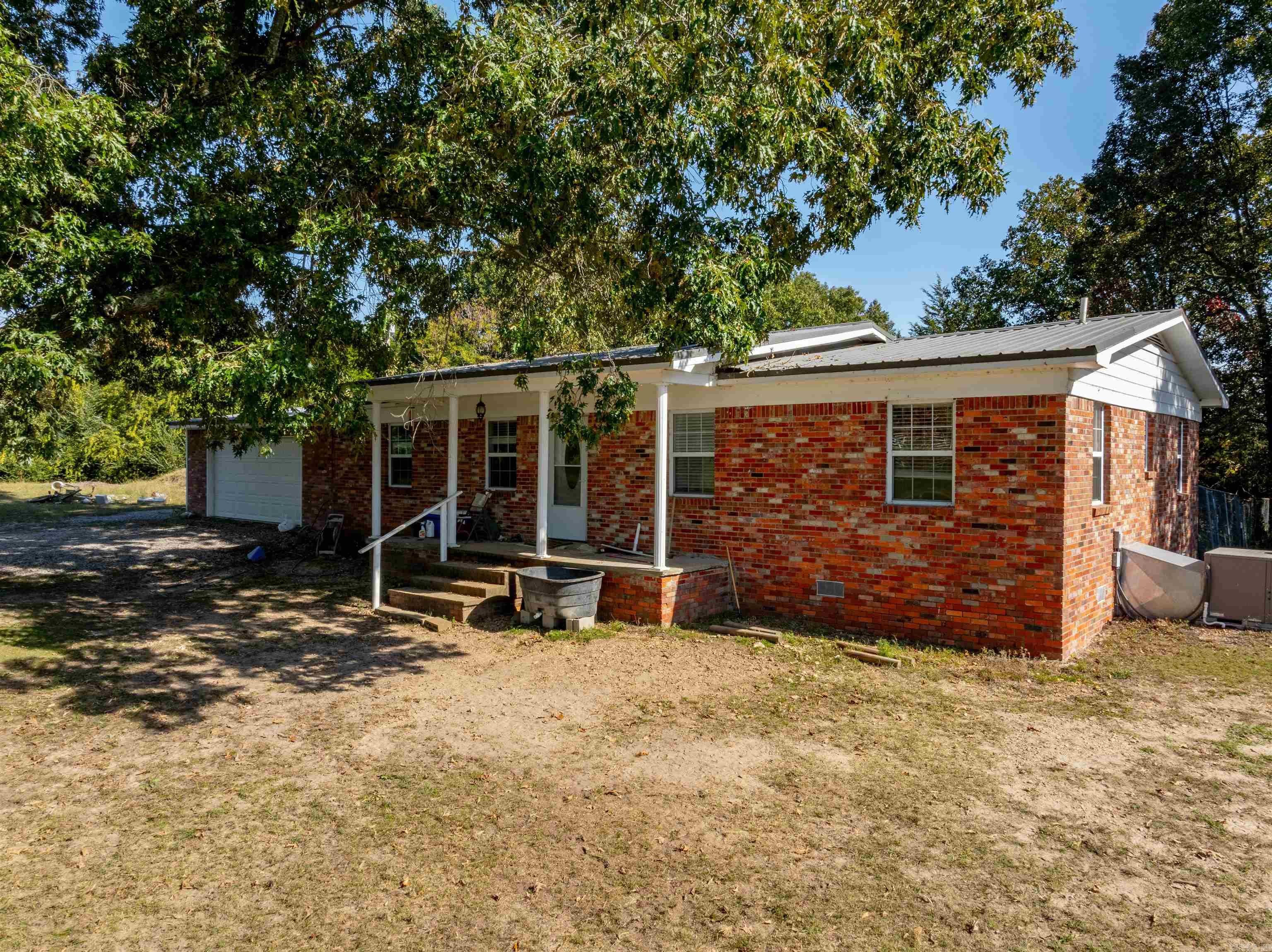 3 Bed 2 Bath,5 +/- Acres,Pond,Pasture Fenced,Cave City,Arkansas,Sharp County!This charming home offers the perfect blend of country living with modern conveniences, nestled on five stunning acres with a peaceful pond view right from your front porch.The property is fully fenced, with a barn ready to accommodate your horses or livestock.As you step inside, you'll be welcomed by beautiful flooring throughout, leading into a spacious living room with plenty of space for a large dining table.The cozy kitchen features an abundance of cupboard space, ideal for all your culinary needs.Off the kitchen is a multi-functional room that leads to a generous laundry room with ample shelving, perfect for a pantry area, and access to a safe room for added peace of mind. An enclosed garage is conveniently located off this room as well.Down the hallway, you'll find a guest bathroom, a bedroom with a door that opens onto a covered deck—perfect for sipping morning coffee or enjoying evening sweet tea.This deck is set within a fenced backyard area, providing a secure space for your pets to roam.Another bedroom awaits at the end of the hall before you reach the primary suite with a large bathroom.