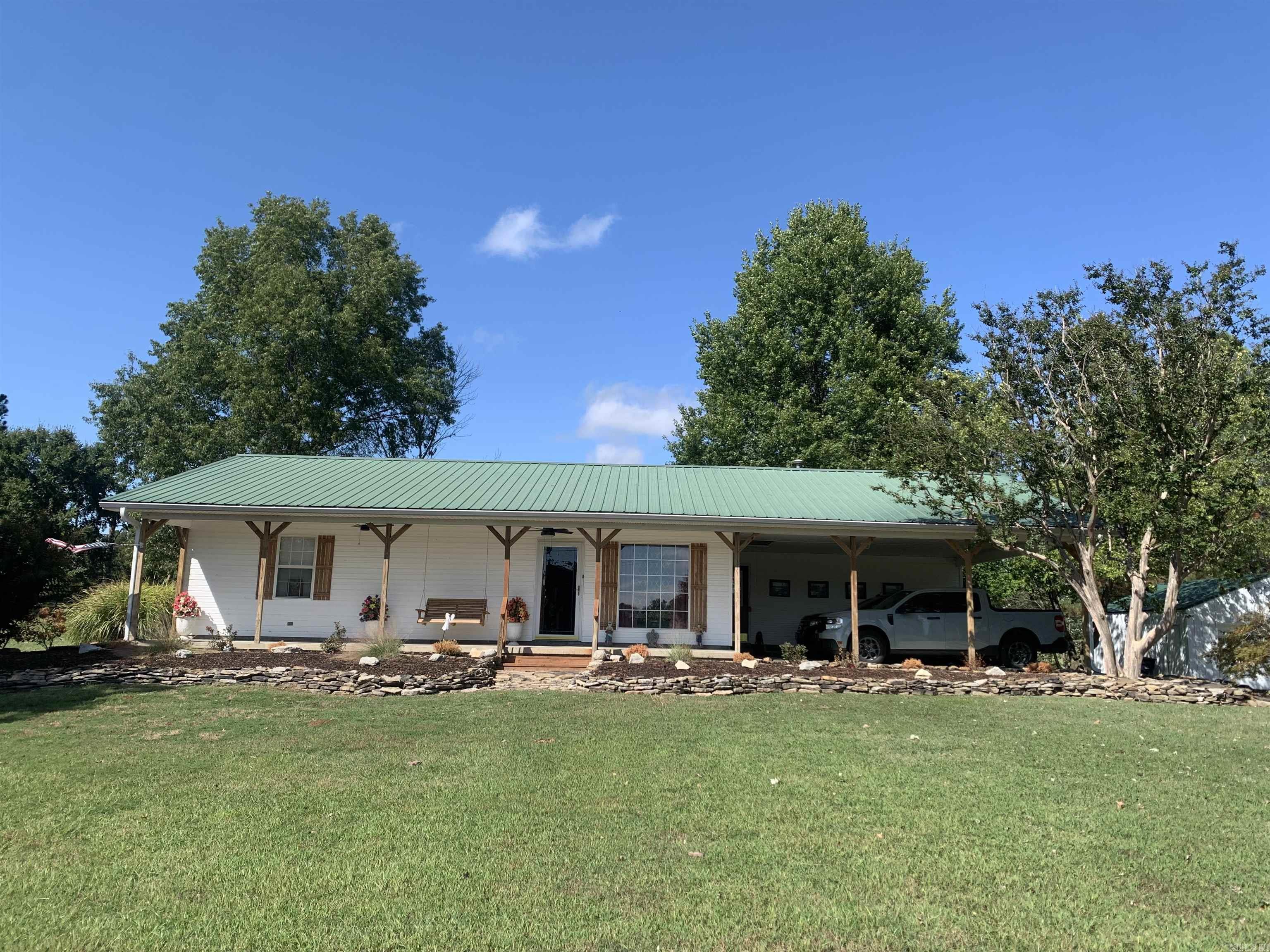 Welcome to 3431 Heritage Park Road in Piggott, Arkansas—a beautifully remodeled home nestled on 19.50 acres of prime, fully fenced land. This 2-bedroom, 2-bath residence offers 1,728 sq. ft. of living space, thoughtfully updated throughout with modern finishes and a comfortable, open layout. The property is set up for functionality and rural living at its best. A new 16x21 shop and a barn provide ample space for storage, equipment, or hobbies, while the sturdy steel fencing ensures durability and security for livestock. With its fencing and layout, the land is cattle farm ready, making it an excellent choice for anyone looking to start or expand their farming operation. Whether you’re seeking a move-in-ready home with acreage, space for your animals, or a serene country retreat, this property has it all.
