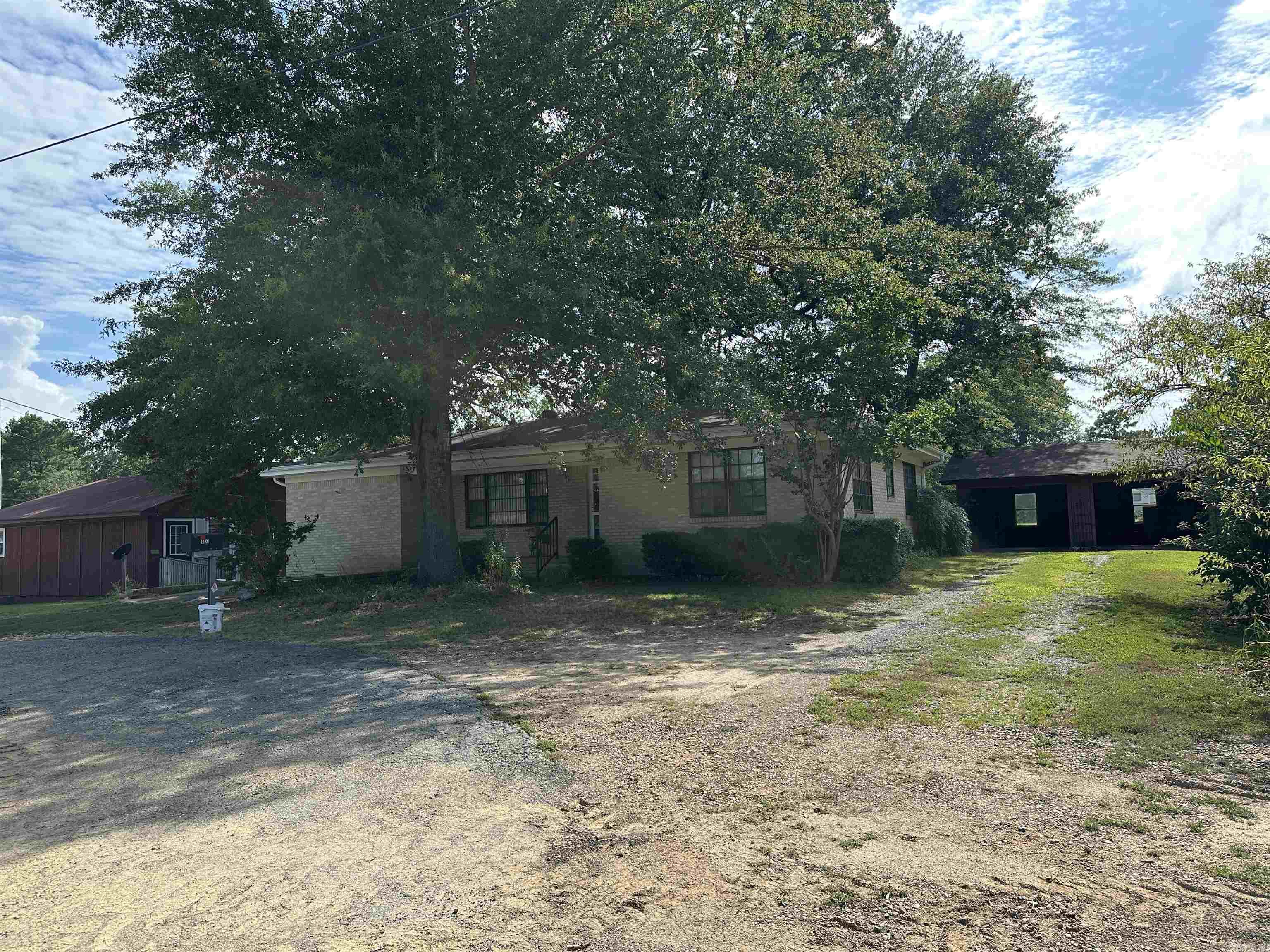Only 2 miles from Lake DeGray! Located at the prominent corner of Highway 7 and Arlie Moore Road, this versatile 1.2± acre property offers a rare blend of residential comfort and commercial potential. With frontage on the newly expanded Highway 7āboasting high daily traffic volumeāthis is a prime location for any business looking to establish a foothold in the rapidly growing Bismarck area. The main structure is a well-maintained two-bedroom, one-bath brick home featuring new HVAC, beautiful hardwood flooring, and detached garage. A second home on the property is currently rented, providing immediate income potential. Historically, the site served the community as a grocery store, gas station, and car washātestament to its strategic visibility and accessibility. Whether you're looking to invest in a thriving commercial location or keep it as a residential property with rental income, this site is flexible enough to accommodate your vision. Bismarck is expanding fast, and this corner lot is ready for the next chapter. Don't miss this opportunity to own one of the best-located parcels in town!