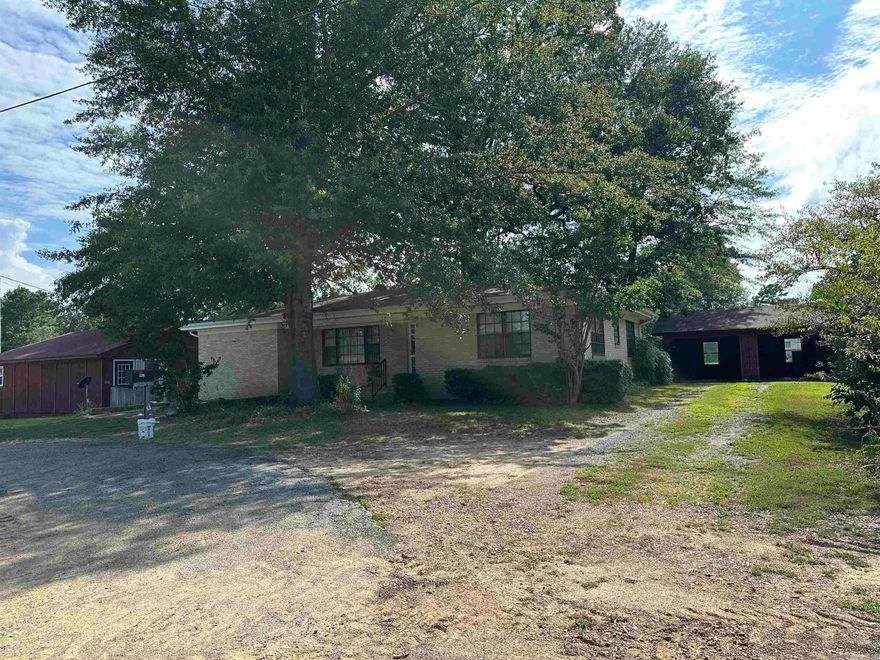 Only 2 miles from Lake DeGray! Located at the prominent corner of Highway 7 and Arlie Moore Road, this versatile 1.2± acre property offers a rare blend of residential comfort and commercial potential. With frontage on the newly expanded Highway 7—boasting high daily traffic volume—this is a prime location for any business looking to establish a foothold in the rapidly growing Bismarck area. The main structure is a well-maintained two-bedroom, one-bath brick home featuring new HVAC, beautiful hardwood flooring, and detached garage. A second home on the property is currently rented, providing immediate income potential. Historically, the site served the community as a grocery store, gas station, and car wash—testament to its strategic visibility and accessibility. Whether you're looking to invest in a thriving commercial location or keep it as a residential property with rental income, this site is flexible enough to accommodate your vision. Bismarck is expanding fast, and this corner lot is ready for the next chapter. Don't miss this opportunity to own one of the best-located parcels in town!