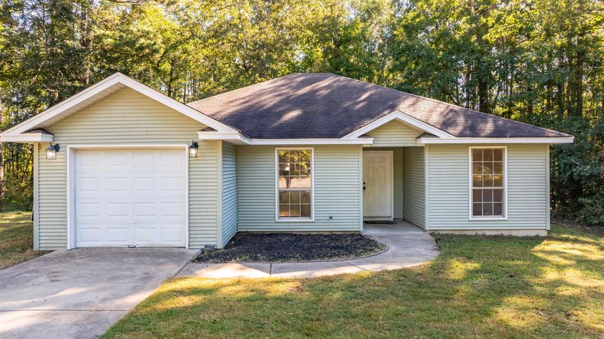 This isn’t the biggest house on the block—or the fanciest zip code—but it might be the smartest buy in town. With 3 bedrooms, 2 full baths, and an open-concept living, dining, and kitchen area, this cozy charmer proves that good things really do come in affordable packages.  From the entry, you're welcomed with an open concept great room highlighting the Kitchen, Dining, and Living areas in a seamless and inviting space.  Two secondary bedrooms share a full bath and the large primary suite with en suite access complete this traditional style home.  Situated on a quiet cul de sac, this one is perfect for the 1st time home buyer, or an addition to the investment portfolio.  We're excited for you to come and see if it's yours.  5 Pine Thicket Ct.  Welcome Home!