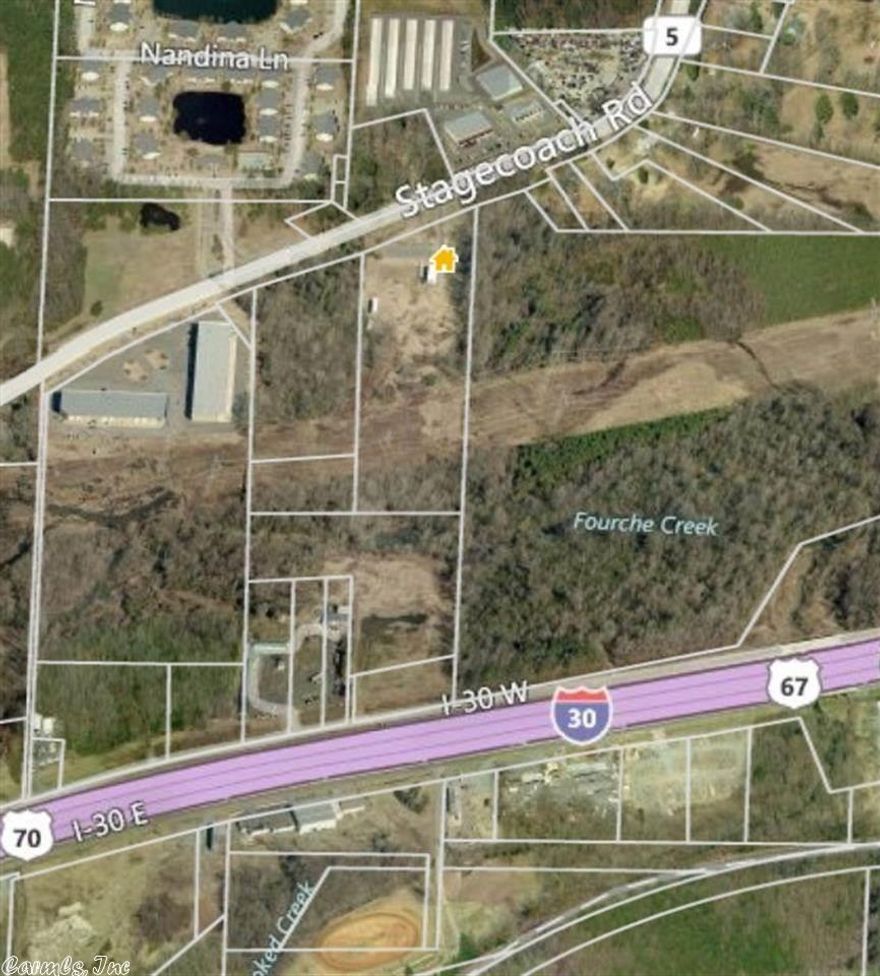 9 acres on Stagecoach road, front of property consists of 5 Acres of flat cleared land. 326 ft. of highway frontage. Close to Bass Pro Shops and proposed Outlet Mall. 30 Car parking lot currently on property. Mobile buildings are being removed.