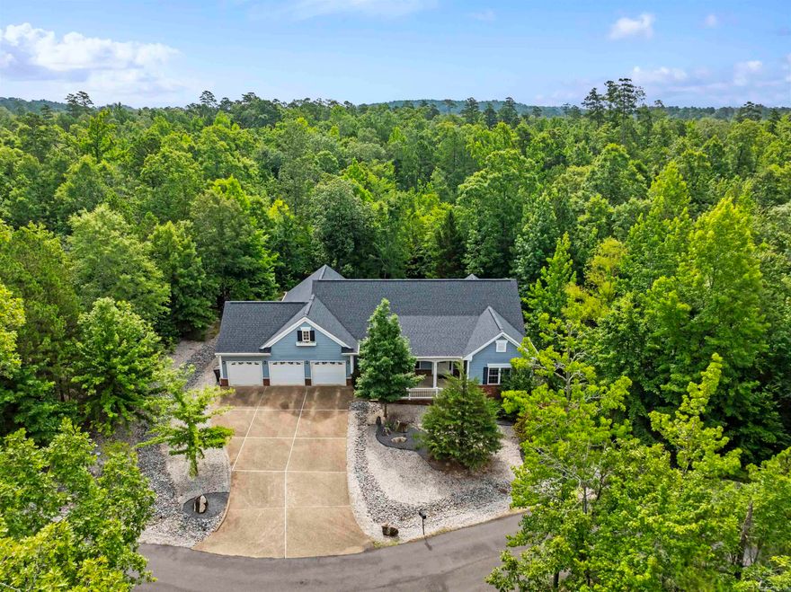 Discover this custom-built, 3 bed, 2 bath gem situated on a level cul-de-sac, ideal for strolls or bike rides. Beautifully landscaped and includes adjacent lot, ensuring unparalleled privacy. Inside, you'll find an inviting formal living room with vaulted ceiling and gas fireplace. A large second living room provides ample space for gatherings. The thoughtful split floorplan ensures privacy for the primary suite, featuring a luxurious bath with a jetted tub and walk-in shower. The primary closet is a dream with built-in cabinetry and direct access to the laundry room for ultimate convenience. Entertaining is a breeze with a dedicated dining room, a bright breakfast area, and convenient bar seating. The kitchen features a fantastic walk-in pantry with custom built-in cabinetry, island with bar sink, and extra counterspace. Home has 3-car garage and a large, level driveway. A unique feature is the staircase off the garage entry leading to an attic space—perfect for storage or ready to be finished out as a bonus room. Enjoy the outdoors on the covered front porch or relax on the covered patio at the back of the house, complete with an open concrete pad for grilling.