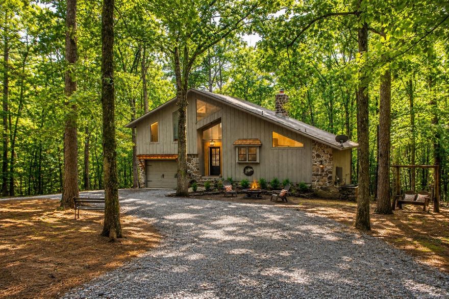 Cozy Cottage in a Wooded Wonderland with a Private Boat Slip  Nestled among the trees, this charming 2-bedroom, 2-bathroom cottage offers the perfect blend of comfort and nature. With 1,550 sq ft of living space, the home feels open yet inviting, featuring warm finishes and large windows that frame the peaceful wooded views.  The thoughtfully designed layout includes a welcoming living area, spacious kitchen, and cozy bedrooms; ideal for family, guests, or a weekend retreat. Step outside and you’ll find yourself surrounded by towering trees and natural beauty, making it a true sanctuary away from the hustle and bustle.  Adding to the charm, this property includes its very own private boat slip perfect for enjoying lazy days on the water, fishing, or sunset cruises.  Whether you’re looking for a full-time residence or a relaxing getaway, this woodland cottage is your chance to embrace a simpler, quieter lifestyle.  Come experience the serenity of life in your very own wooded wonderland with lake access at your doorstep!