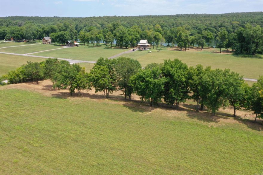 Beautiful building site in a gated community on the World renowned White River. There is 4.7 acres that has had the under brush cleared so that you can see through the trees to the White River. Build your Dream Home and enjoy the amenities of having access to the Boat Ramp and being on the River in just minutes.