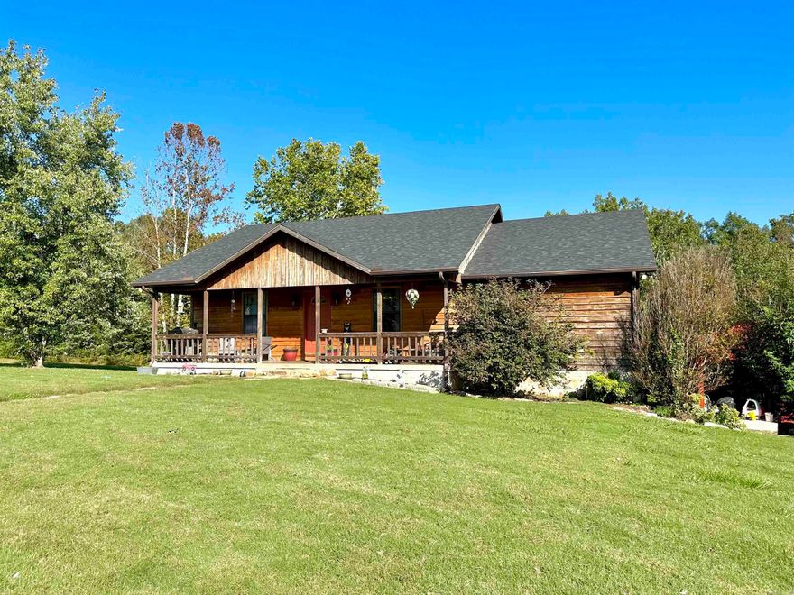 Well maintained 3 bedroom/2.5 bath home on 5 acres outside Calico Rock. The living area has a vaulted ceiling and access to a large back deck! The open kitchen/dining area has custom hickory cabinets. The master bedroom offers a walk in closet & a full bathroom with a walk in shower. The basement makes a great family room/game room & has a 1/2 bath, storage space, & oversized 2 car garage. There is a 24x32 shop, above ground pool, tree house, chicken coop, & entertainment area outside! The home has a new roof & new HVAC system that is 1 year old! Located close to Norfork Lake and the White River!