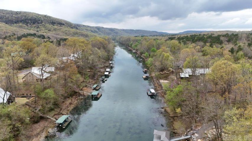 Discover carefree riverfront living at Rivers Edge, a zero-maintenance subdivision on the Little Red River! This beautiful lot offers direct river access and is just a short stroll from the community pool and boat dock. Enjoy the peace of mind of a gated entry, private sewer system, city water, and stunning mountain views. With all underground maintenance, private roads and pool access included for a low $100 monthly association fee, now is the perfect time to build your dream home and embrace riverside relaxation in Heber Springs. Your weekend fishing adventures await! Don't wait to experience the good life in Heber Springs ā make this riverfront lot yours today!
