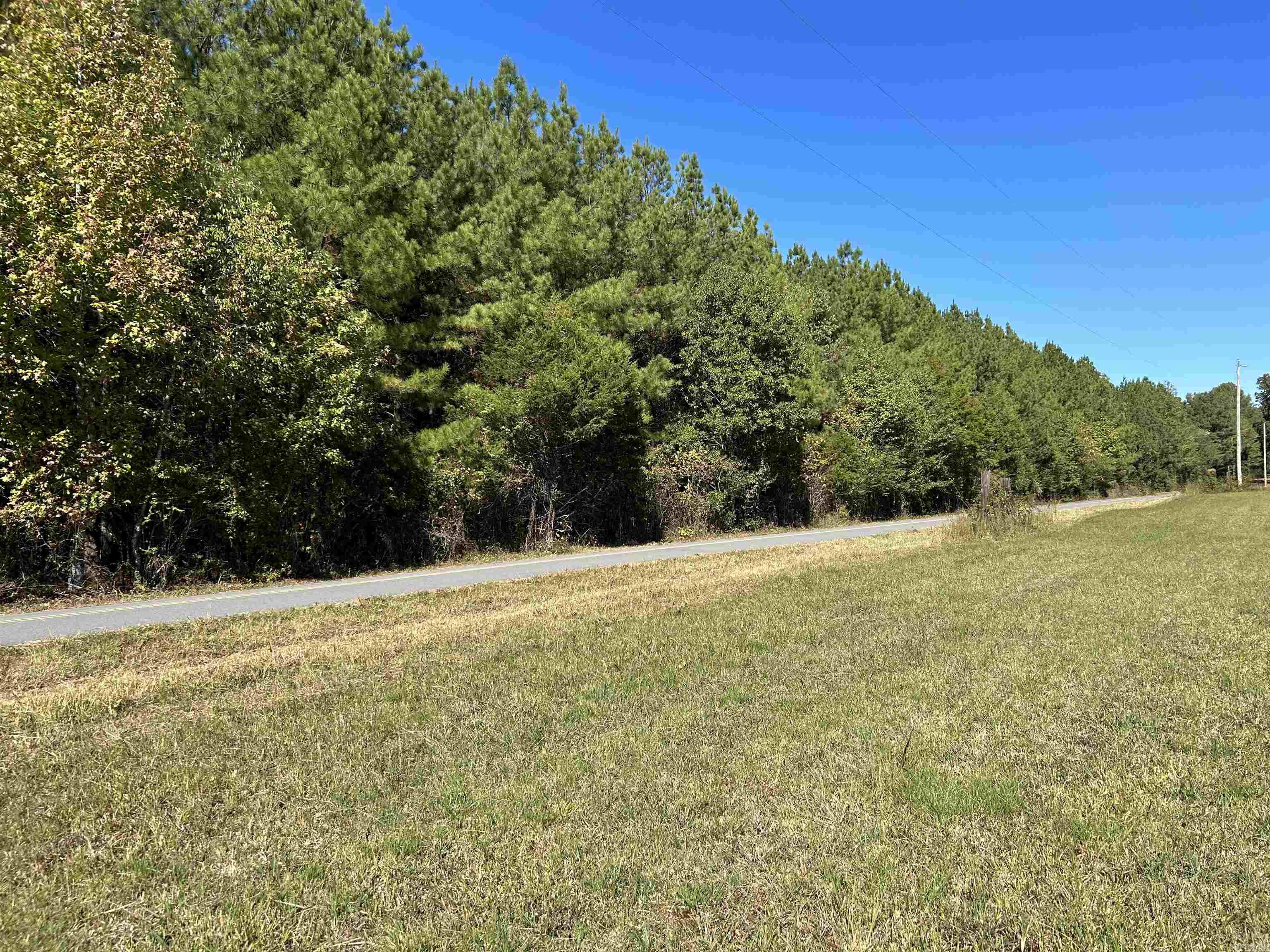 13.86 acres of beautiful wooded property with hardwoods and Plantation Pine Trees. Land has water, electricity and a pond. Located right off the Vilonia ByPass. SEE AGENT REMARKS.