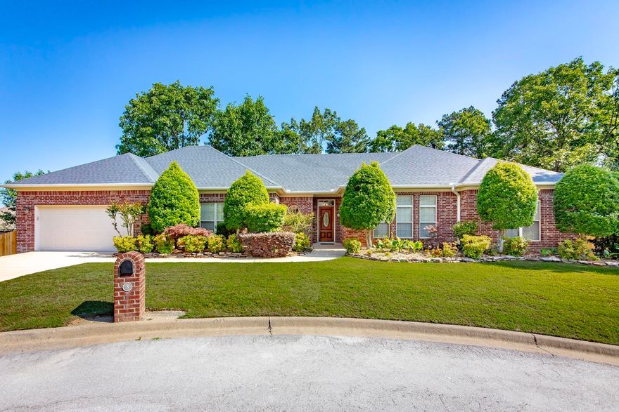 8 Castle Rock Cove is a rare opportunity to own a custom-built one-level home tucked away on a quiet cul-de-sac in the highly desirable Peddle Beach Woods subdivision. Situated on a beautifully landscaped half-acre lot, this thoughtfully designed home offers over 3,000 square feet of comfortable living space with a perfect blend of warmth, functionality, and timeless style. Inside, you’ll find 4 oversized bedrooms, 3 full bathrooms, beautiful hardwood flooring, and a unique cork floor in the kitchen that adds both character and comfort. The spacious layout is ideal for everyday living and entertaining, featuring two fireplaces, generous living areas, and abundant natural light throughout. The large primary suite serves as a private retreat with double vanities, a soaker tub, steam shower, and walk-in closet. Additional highlights include a whole-home generator and a deck overlooking the fenced backyard that leads to a workshop/storage area beneath the home—perfect for hobbies, tools, or extra storage. With custom craftsmanship, oversized rooms, and an unbeatable location, this one-owner home is truly something special. Agents see remarks