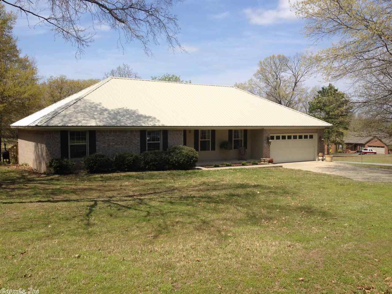 MOTIVATED SELLER WILL LOOK AT ALL OFFERS!! Priced well below appraised value! New metal roof, new paint, carpet and laminate flooring looks better than wood in 2013. Large rooms and big laundry room, great storage in the garage. Huge bonus room with large closets that they are currently using as an office and storage. One of the closets could easily be converted to a bathroom. Roomy deck with a nice covered area. Storage building with lean to perfect to store your tools. All of this on a large corner lot!!