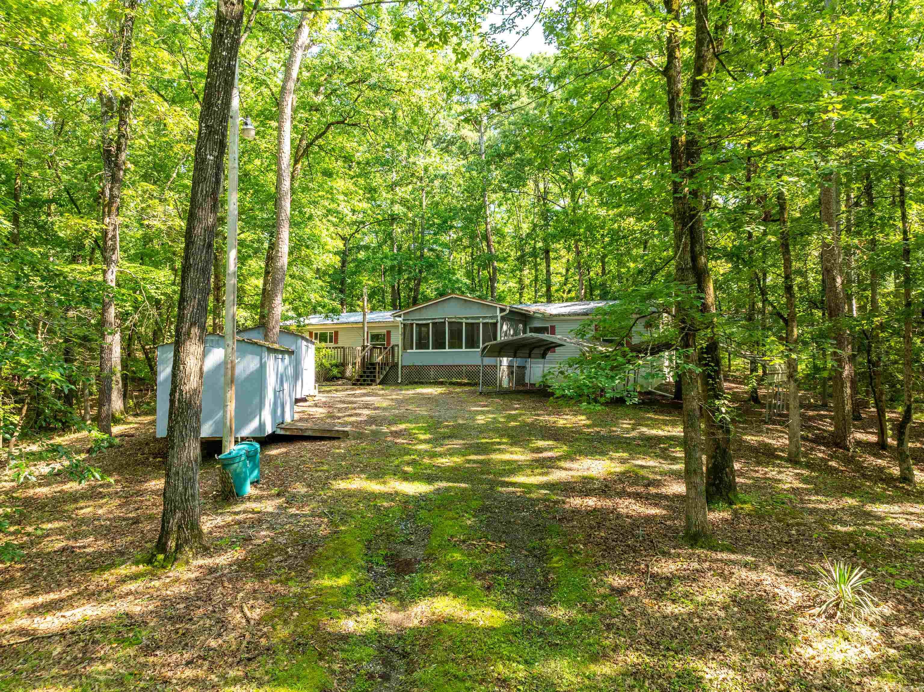 Located just minutes from Lake Ouachita, this spacious 4-bedroom, 3.5-bath modular home offers approximately 2,356± sq ft of well-designed living space. With an open layout, ample natural light, and generous room sizes, this property combines comfort and convenience in a serene setting near one of the area’s most popular recreational destinations.