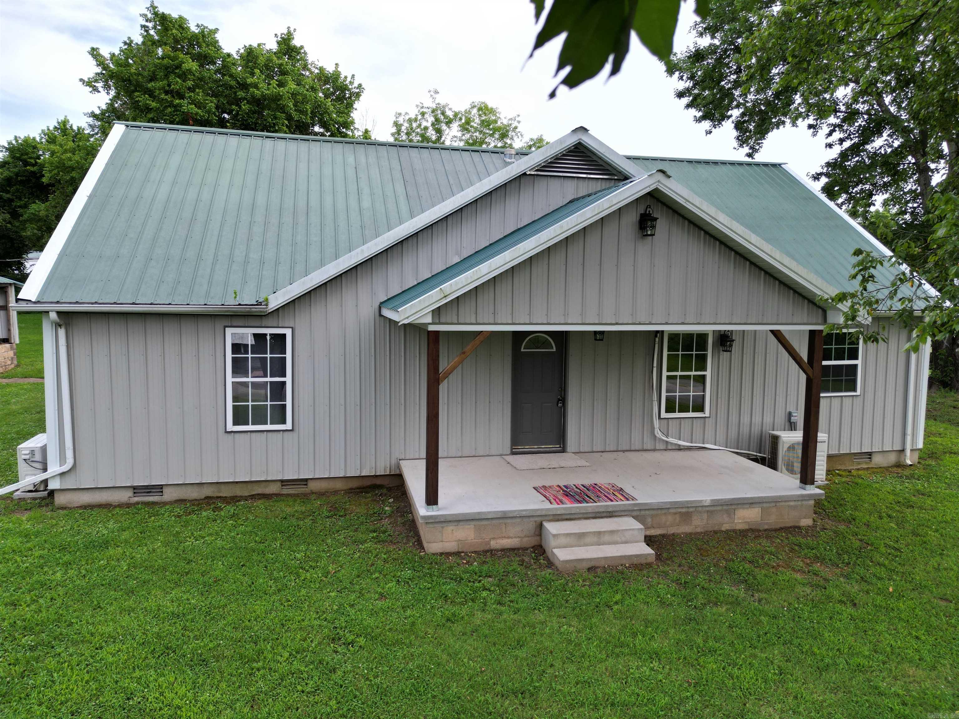 Just 3.5 miles from the Buffalo National River to the Baker Ford access, this is the ideal spot for a vacation rental or if you love the Natural State and all the adventures to be had in the outdoors, make it your own dwelling. The exterior of the home is nearly maintenance free. There are several mini split air conditioning units where climate control is a personal preference for individual rooms. The home comes with plenty of storage space from cubby areas, cabinets, and closets. This recently remodeled home is move in ready with appliances conveying with the property. The outbuilding would make a great carport or workshop. With just under an acre of land, it is manageable, and has easy to access form the 2 lane Hwy 374. Inspection has been done and inspection items have be repaired as noted in the report.