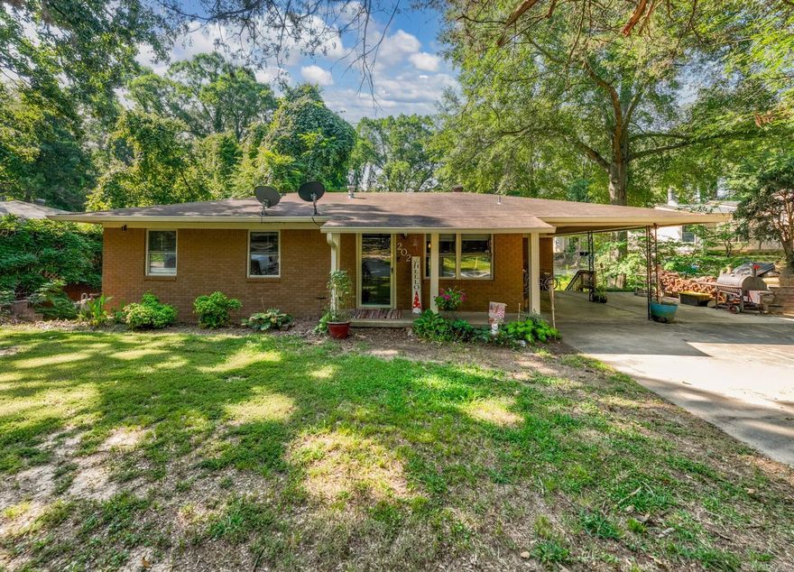 BONUS SPACE GALORE! Be sure to watch the video walkthrough on YouTube: https://youtu.be/xlfK41DorY0  This 4 bed, 2 bath home is more than just that! This home features a downstairs area that has an primary suite with walk-in closet, bonus living room, a laundry room, pantry area that doubles as a safe room, and a game room/man cave! The upstairs features a living room, large kitchen with breakfast bar and extra storage, 3 bedrooms, and a guest bathroom with double sinks & shower/tub combo. You'll find a plethora of storage closets throughout the house. The backyard is fenced-in all the way around and has a smaller fenced-in area behind the house for pets or a play area. The lot feels larger than 0.35 acres and is in a quiet neighborhood. Lake #1, Lake #2, and I-40 are both 1 mile away. The Old Mill is 1.5 miles from here.