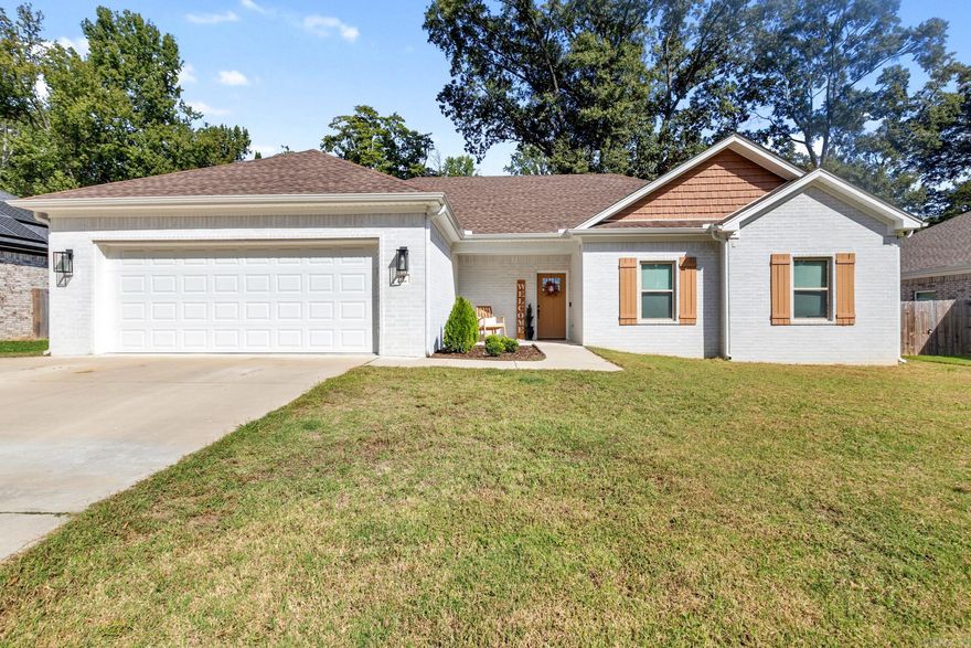 Welcome Home to this Beautiful, still like new 4 Bedroom 2 Bath Open/Split floor plan. The curb appeal is stunning with Beautiful White Concrete Brick and Wood  tone accents. Nice front porch with landscaping sets the tone as you walk in to a stunning LR with Electric FP. Wide Open Kitchen/Dinning with big Island and lots of Cabinets, Master Bedroom is a great size and added bonus of Electric FP/Shiplap wall, huge master closet with built ins and great master bath, Laundry is easily assessable from Master. 3 other nice size bedrooms with great closets and a Big 2nd Bath. The Garage is even done right in this one. Set up as a work out area but the Back porch and nice size back yard finishes this one of nicely.  Great Location near everything. Call today