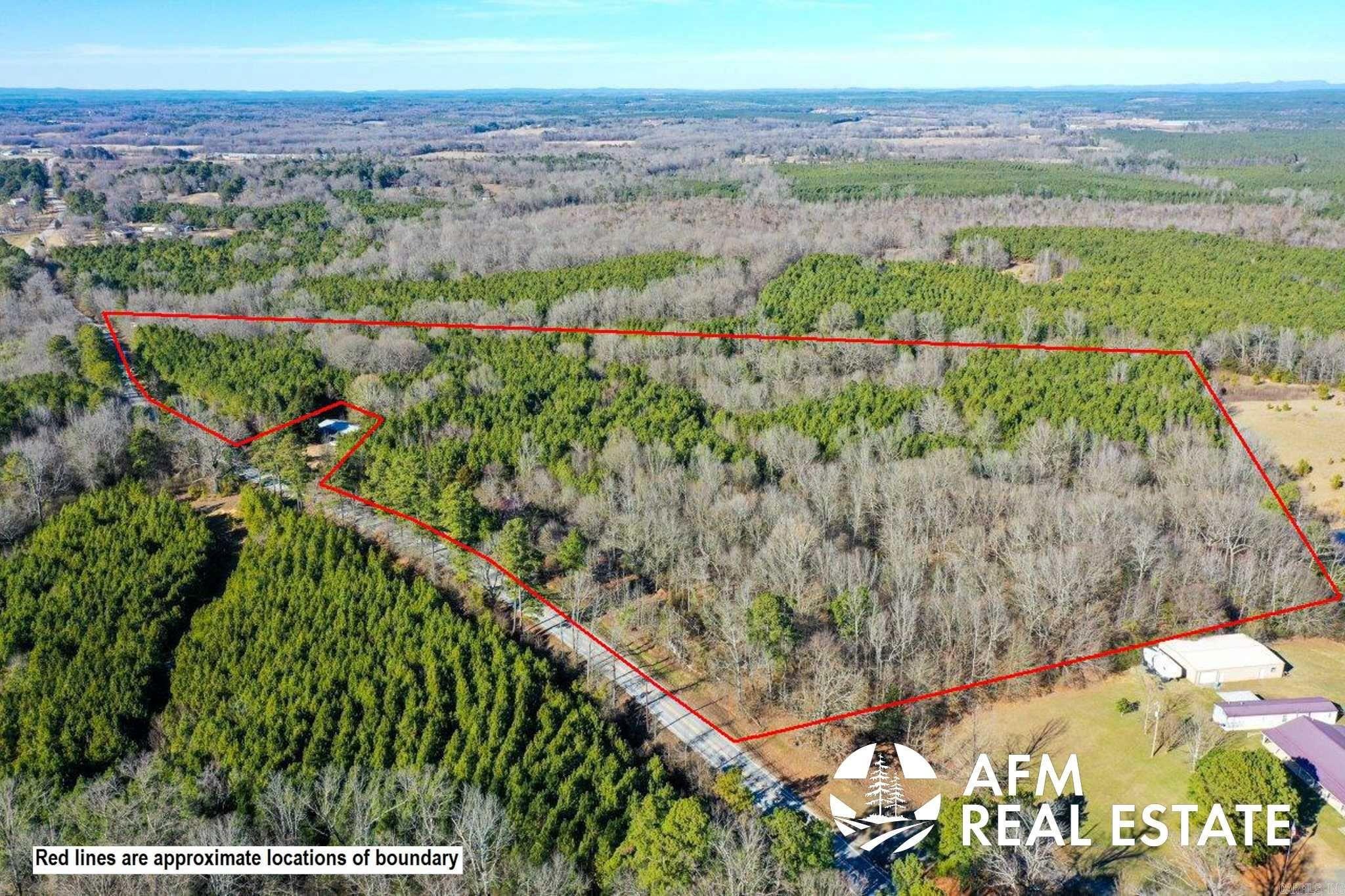 Property Highlights: Acreage: 29.81 acres of pristine timberland. Topography: Gently rolling terrain ideal for various outdoor activities. Access: Convenient highway access ensures easy connectivity. Pond: Features a tranquil pond adding to the natural beauty and wildlife habitat. Timber: Abundant mature timber throughout the property. Building Potential: Perfect site for constructing your dream home or cabin. Utilities: Available at the road for easy connection. Recreational Opportunities: Prime location for hunting enthusiasts with nearby hunting grounds. Proximity to Lakes: Close to lakes offering fishing, boating, and recreational opportunities. Wildlife: Surrounded by the natural splendor of the National Wildlife Refuge. Embrace the charm of rural living with the convenience of modern amenities. Whether you're seeking a private getaway, a hunting retreat, or a peaceful place to call home, this property offers endless possibilities. Don't miss out on this rare opportunity to own a piece of Arkansas' natural beauty. Schedule your showing today and start envisioning your future on this remarkable timberland estate.