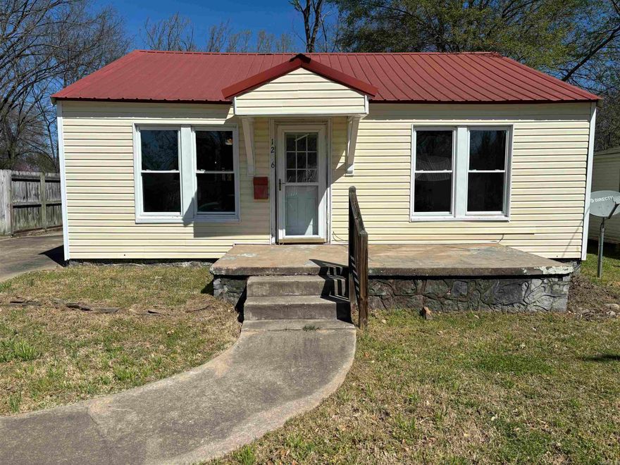 Don't miss this updated, affordable home. Perfect for a starter home for college students, young couples or for someone looking to downsize. This house has updated paint, lighting  and flooring. Large laundry room,  new range/oven and water heater. Outside features are a metal roof, power washed siding and back covered deck. Large enclosed back yard. Book your appointment today!