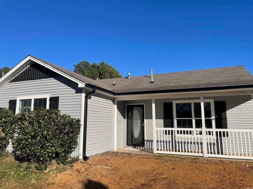 Recently remodeled with all new in 2022: New HVAC unit, exterior and interior paint, custom shutters, gutters, new LVT flooring w-carpet in bedrooms, toilets and sinks, faucets and plumbing fixtures, fans and light fixtures, new granite, appliances. Privacy fenced yard with storage. CONWAYCORP UTILITIES!