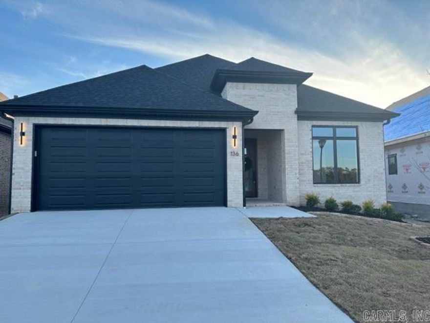 Are you ready for your dream home in a dream neighborhood? Welcome home to 136 Fletcher Ridge Drive. This Graham Smith Construction masterpiece has been meticulously designed with your every need & want in mind. Enjoy on trend designer finishes throughout your new home including quartz counters and custom cabinetry in your chef's kitchen. The layout is an entertainer's dream with a dining room that flows seamlessly into your kitchen area which overlooks your charming living area equipped with a cozy fireplace. The owner's suite is thoughtfully located on the back of the home and features a luxurious soaking tub, a separate walk-in shower, and an abundance of counter & cabinet space in addition to two sinks. You will also find an expansive walk-in custom closet. This home truly offers it all! Estimated completion of January 2024