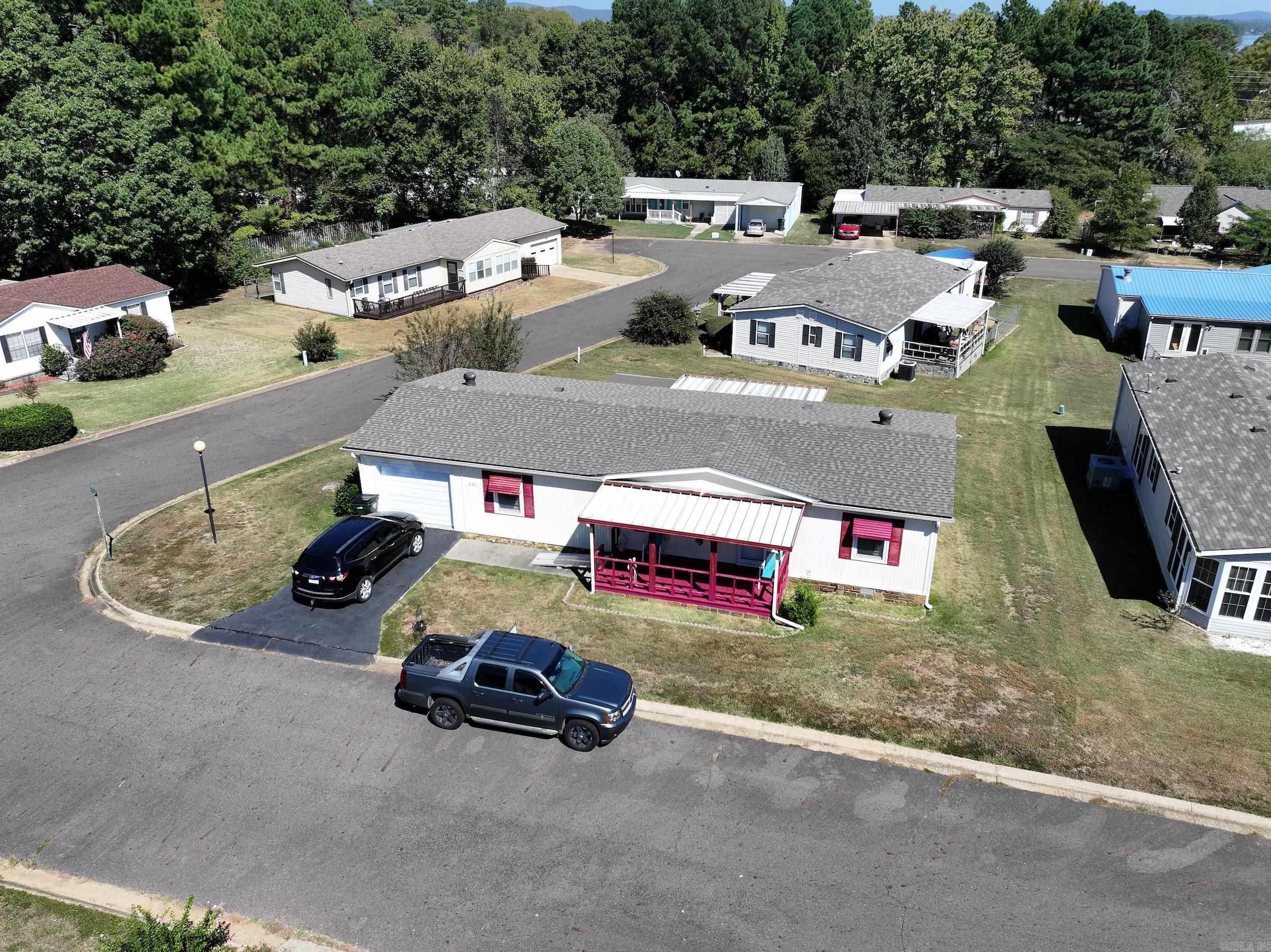 Charming Mobile Home in 55+ Subdivision! Enjoy the vibrant community  amenities, including a spacious clubhouse and pool. This 2-bedroom, 2-bath features a 1-car garage, front porch, and a sunroom and deck on the back perfect for relaxing. Comes mostly furnished and ready for your personal touch. Don’t miss out on this opportunity to live in an established neighborhood!