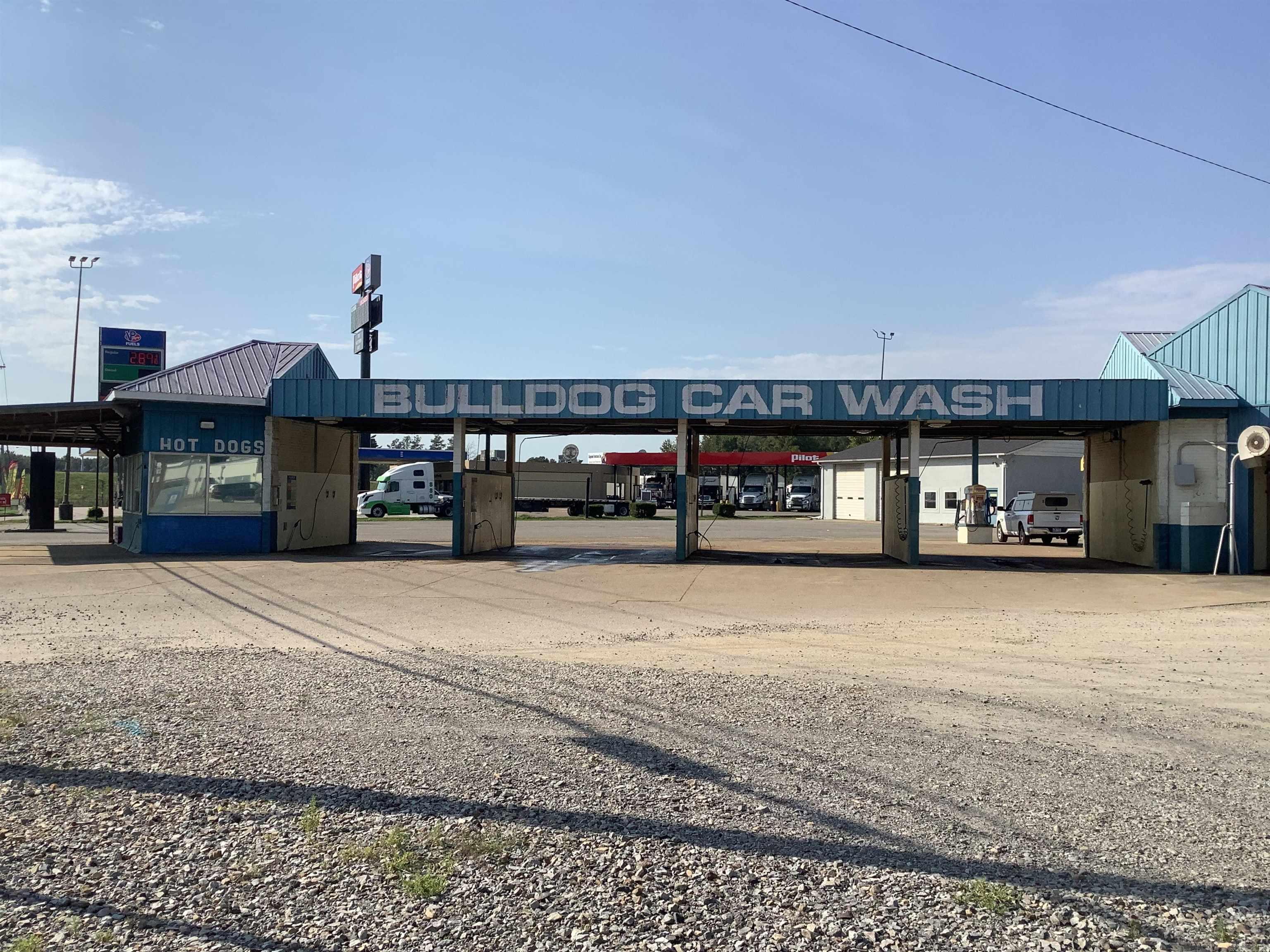 The Bulldog Car wash is located at Exit 55. It puts this property at a perfect location for travelers going through North Central Arkansas, Missouri, and Tennessee. It has a touchless car wash and 4 self-wash bays, there are also 3 car vacuums. There are 2 small buildings attached to the car wash. One houses the car wash mechanisms, and the other one can be another small business or an office.