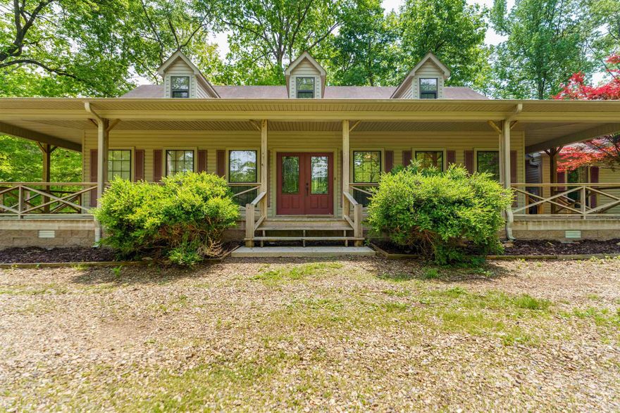Welcome to your dream homestead! This beautiful 4-bedroom, 3-bath home offers 3,000 sq ft of comfortable living space on a level 7.93-acre property less than 1 mile from Jessieville school. This home is perfect for those seeking space, privacy, and the charm of country living. Step onto the inviting wraparound porch and take in the views of wildlife all around. Inside you'll find two generous living areas, woodburning fireplace, gleaming hardwood floors and a wall of windows to enjoy the natural light. The thoughtfully designed kitchen features granite countertops, stainless steel appliances and a large walk-in pantry. The spacious laundry room could double as a craft room. And don't forget about the drop zone built for convenience and functionality. The property also features an oversized 2 car garage with a separate 3rd ATV garage. Outside you'll find a flowing creek, RV hookup, barn and fencing for livestock, so whether you're starting a hobby farm or simply want wide-open space, this property offers that flexibility and freedom. NEW ROOF 2025! Recent deck repairs have been completed, and the seller is offering a $1,000 credit to put toward painting it to suit your style.