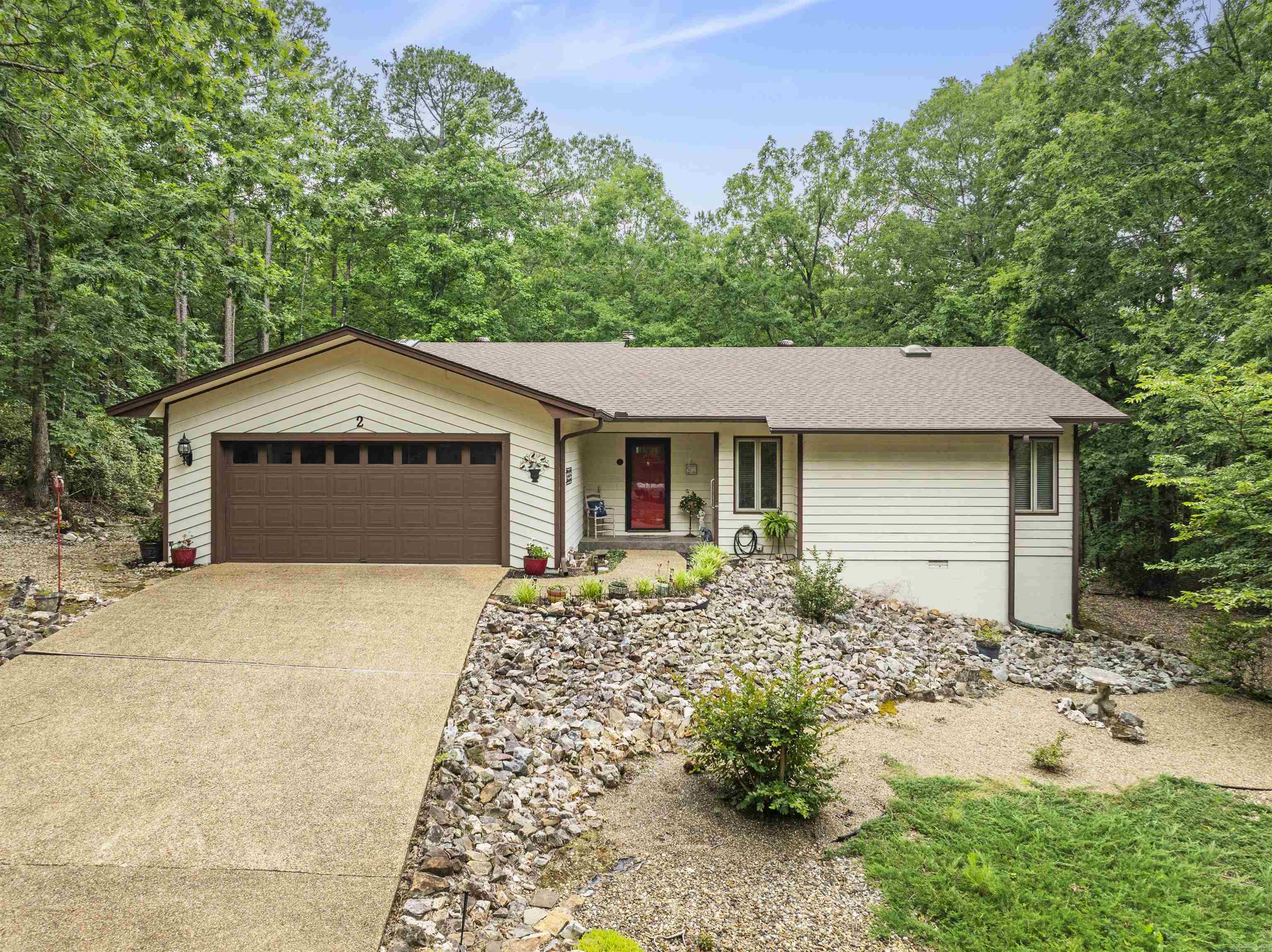Welcome to this charming 3-bedroom, 2-bath home with 1,794 sq ft of inviting living space. The open-concept layout welcomes you with a cozy gas fireplace in the living room, perfect for relaxing or entertaining. Enjoy the bright sunroom filled with natural light from a wall of windows. Step out onto the back deck to take in the peaceful, fenced backyard with views of a mature wooded forestāno neighbors in sight! Recent upgrades include LVP flooring (2023), quartz kitchen countertops (2023), tiled master shower with granite vanity (2022), new roof and two skylights (2025), and backyard fence (2019). HVAC and water heater were both replaced in 2018. Washer and dryer convey. This lovingly maintained home is move-in readyācome see it for yourself!**See Video Attached to Listing** Agents See Remarks**